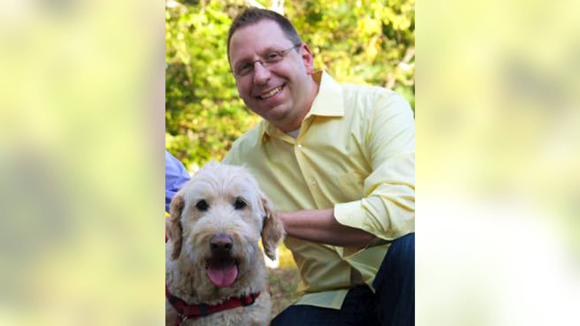 In this Sept. 2015 photo provided by Erin X. Smithers, Michael Templeton poses with his dog in Lincoln, R.I. Templeton, 38, said he was fired from his job as music director at the Church of St. Mary in Providence, a post he held for five years, after marrying his same-sex partner. An ideological tug of war over his firing illustrates the confusion in some U.S. Roman Catholic parishes over Pope Francis’ words on homosexuality. The pope's declaration “Who am I to judge?” in 2013 energized Catholics who had pushed the church to accept gays and lesbians. Three years later, some gay Catholics and supporters who had hoped for rapid acceptance find themselves stymied by many bishops and pastors. (Erin X. Smithers via AP)