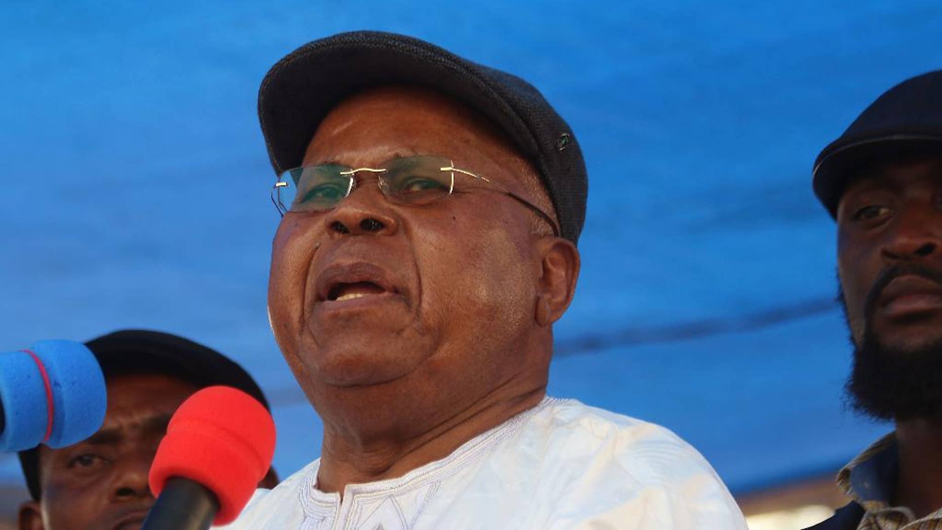 FILE-In this file photo dated Wednesday, July 31, 2016, Congo opposition leader Etienne Tshisekedi speaks during a political rally in Kinshasa, Congo. The coalition, recently formed by popular opposition leader Etienne Tshisekedi, called for a general strike on Tuesday, Aug. 23, 2016, to protest talks meant to ease tensions ahead of upcoming elections. (AP Photo/John Bompengo,File)