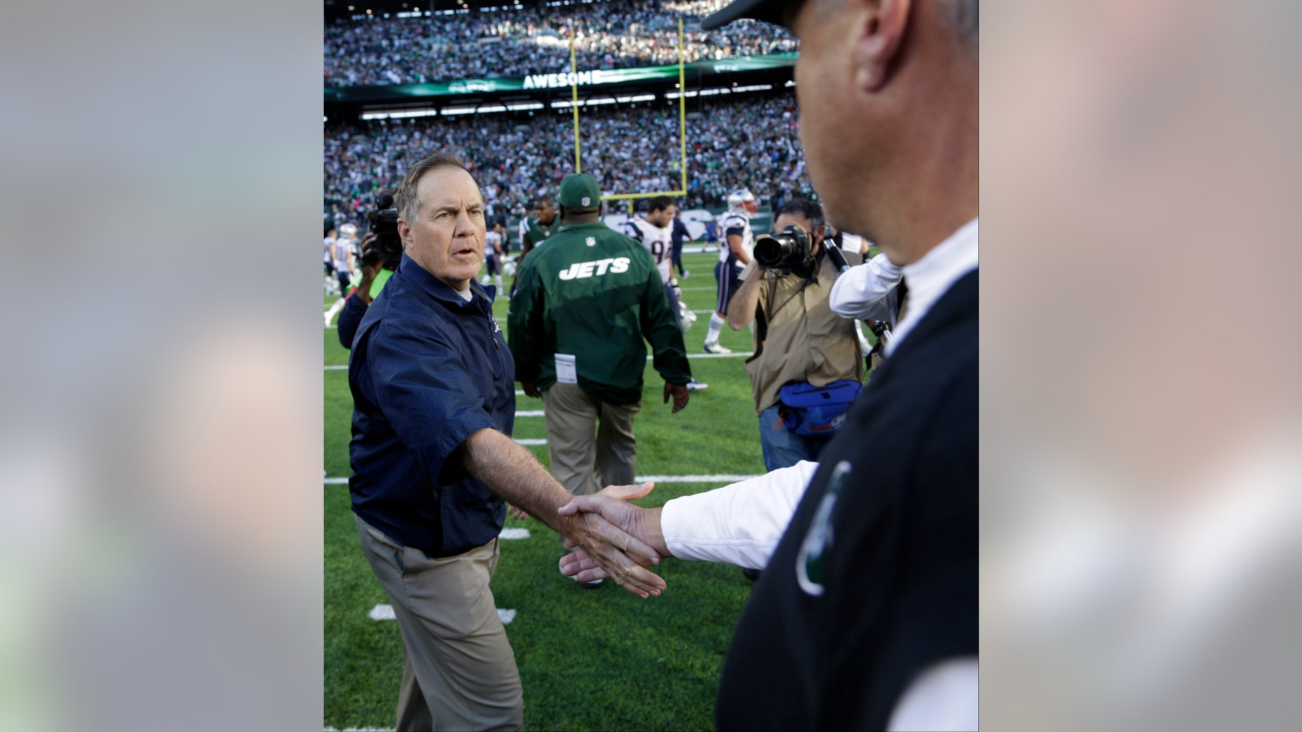 New England Patriots head coach Bill Belichick shakes hands with New York Jets head coach Rex Ryan after an NFL football game Sunday, Oct. 20, 2013 in East Rutherford, N.J. The Jets won the game 30-27. (AP Photo/Seth Wenig)