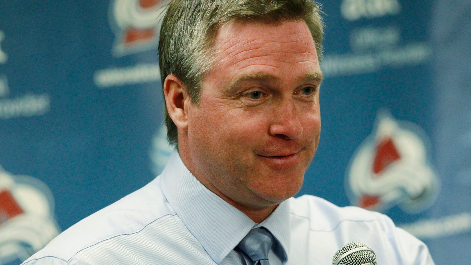 FILe - In this Oct. 2, 2013 file photo, Colorado Avalanche head coach Patrick Roy smiles as he takes questions after the Avalanche's 6-1 victory over the Anaheim Ducks in a hockey game in Denver. Behind the goalie-turned-coach, the team is 6-0 and can match the best start in franchise history with a win over the rival Red Wings on Thursday night, Oct. 17, 2013. (AP Photo/David Zalubowski, File)