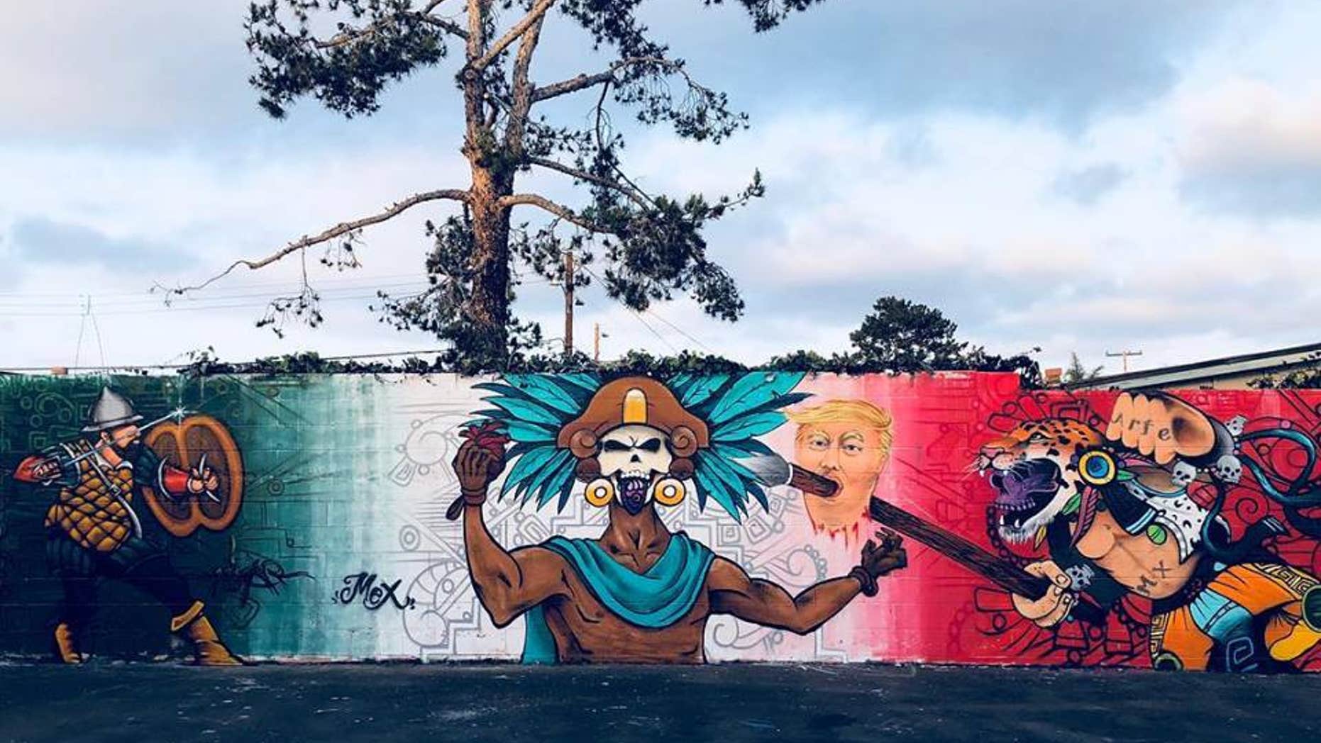 After community outrage, school officials in California covered part of artist Sasha Andrade's controversial mural depicting President Donald Trump's severed head.