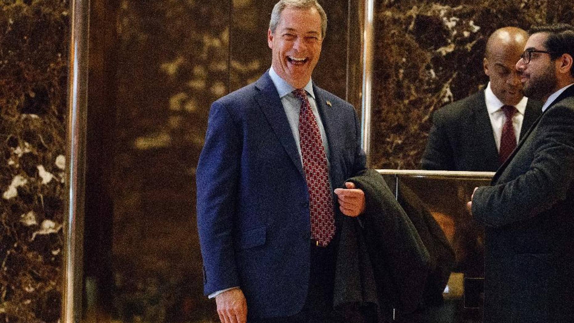 FILE - In this Saturday, Nov. 12, 2016 file photo, U.K. Independence Party leader Nigel Farage smiles as he arrives at Trump Tower, in New York. Officials in Prime Minister Theresa May’s government rejected the idea of Farage to be its go-between with the incoming Trump administration on Sunday Dec. 18, 2016, after Farage argued he would be ideal given his bond formed on the U.S. presidential campaign trail with Trump. (AP Photo/ Evan Vucci, File)