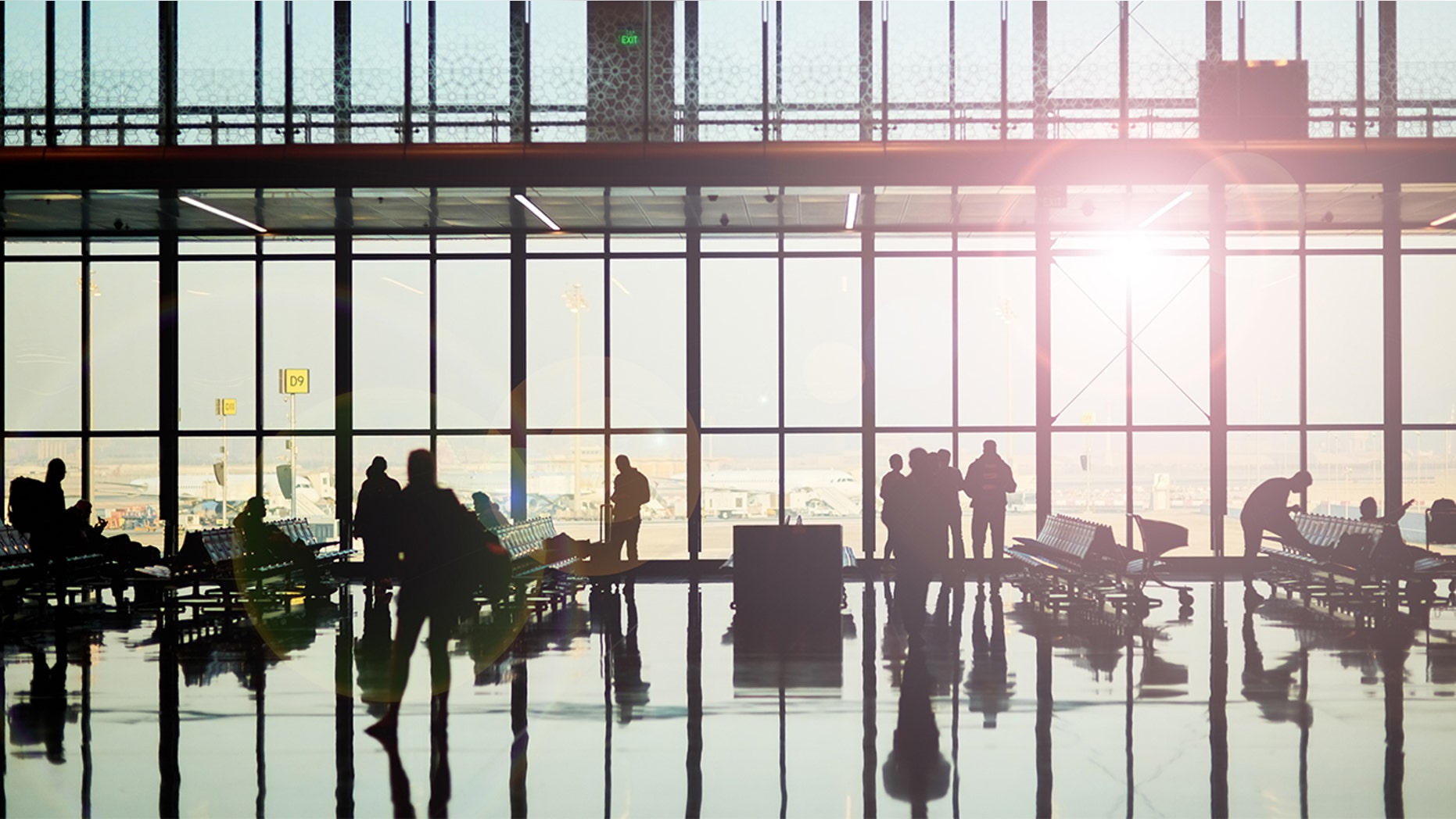 A woman's airport limbo trick has gone viral.