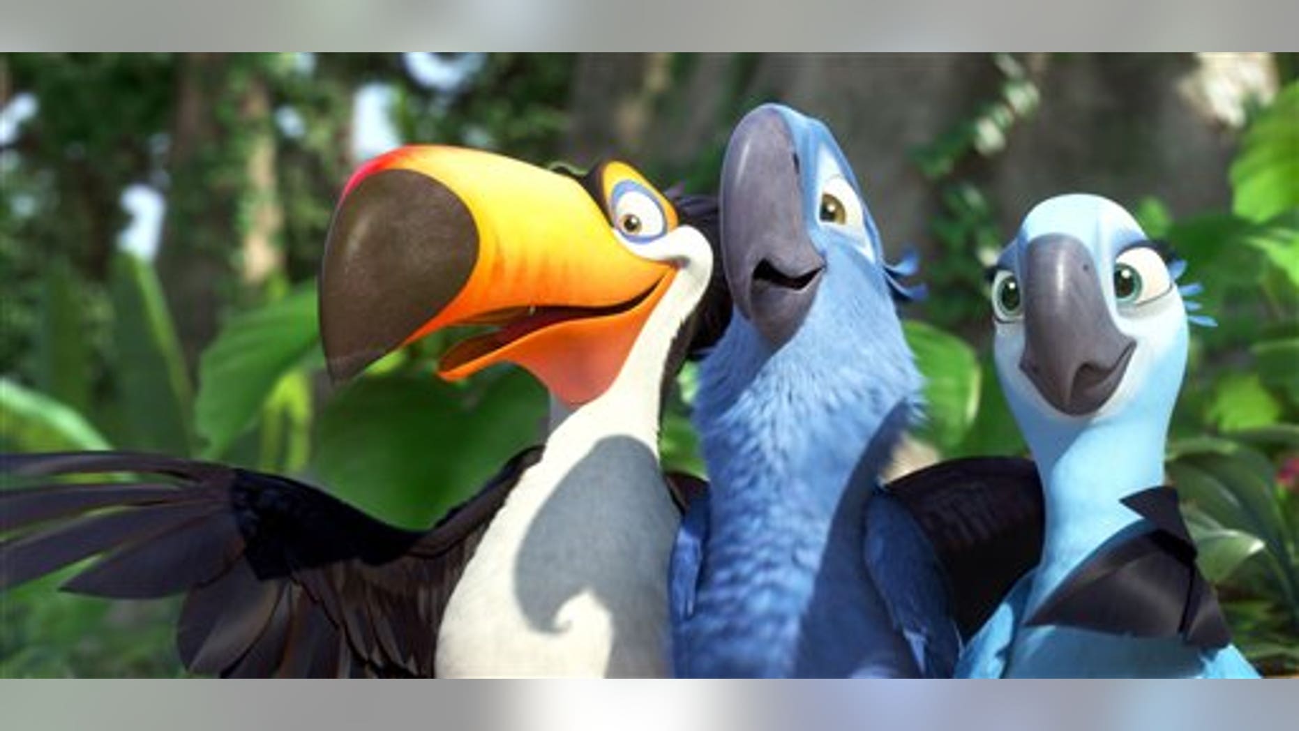 In this publicity image released by 20th Century Fox, animated characters, from left, Raphael, voiced by George Lopez, Blu, voiced by Jesse Eisenberg, and Jewel, voiced by Anne Hathaway, are shown in a scene from "Rio." (AP Photo/20th Century Fox)