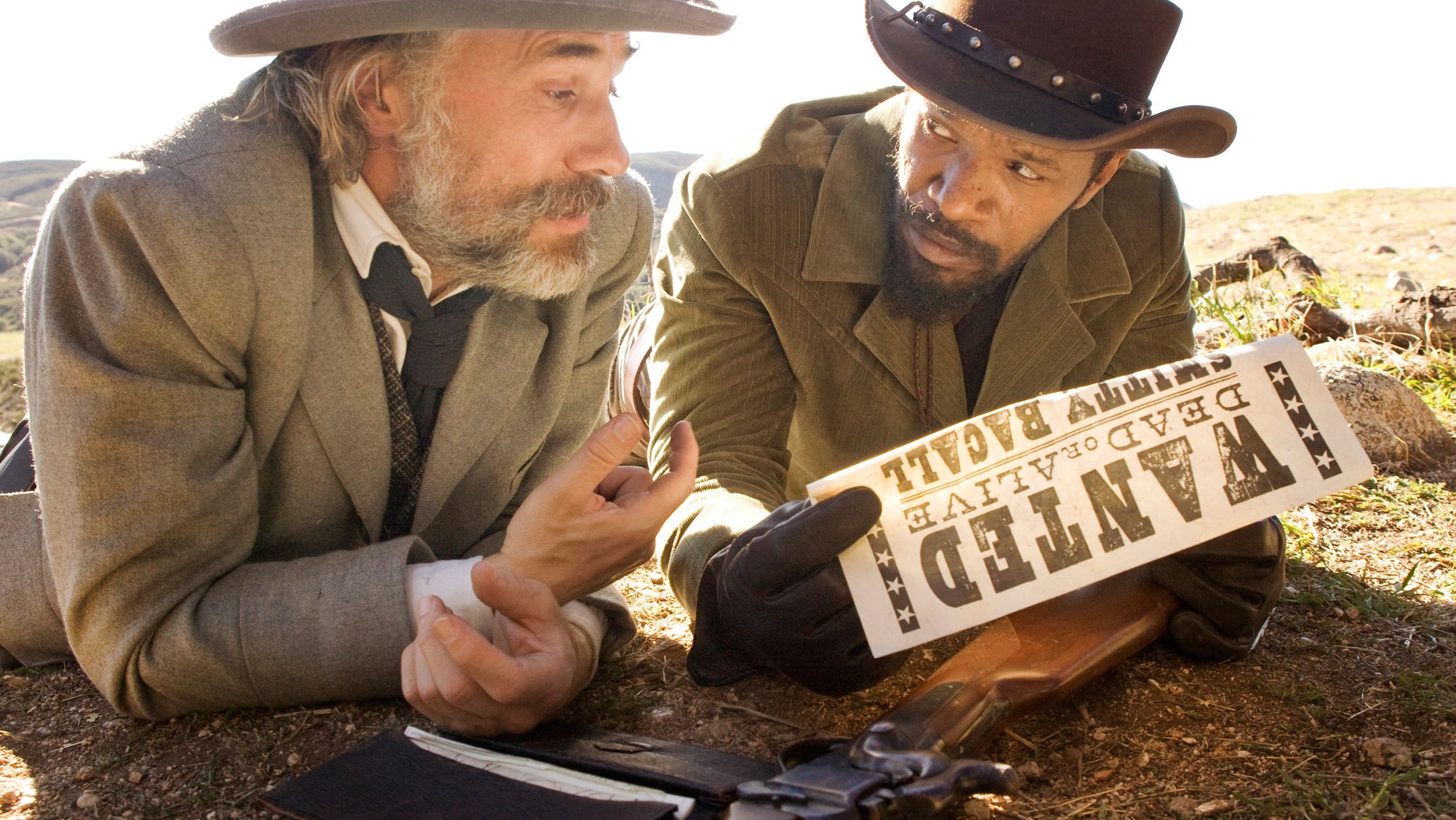This undated publicity image released by The Weinstein Company shows, Christoph Waltz as Schultz, left, and Jamie Foxx as Django in the film, "Django Unchained," directed by Quentin Tarantino. Foxx says Hollywood should take some responsibility for tragedies such as the deadly school shooting in Connecticut on Friday, Dec. 14, 2012. In an interview Saturday, Dec. 15, 2012, Foxx said actors cannot "turn their back" on that fact that movie violence can "influence" people. (AP Photo/The Weinstein Company, Andrew Cooper, SMPSP)