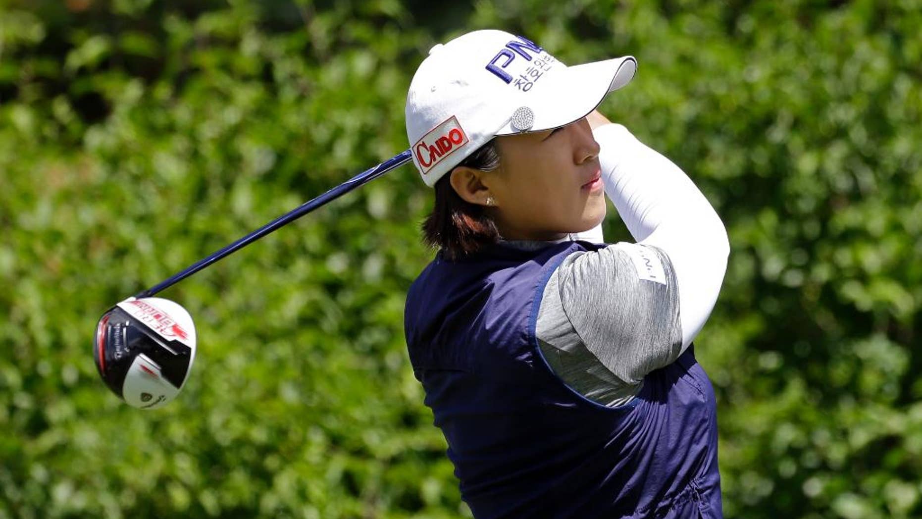 Amy Yang, of South Korea, tees off on the first hole in the final round at the Women's PGA Championship golf tournament at Sahalee Country Club Sunday, June 12, 2016, in Sammamish, Wash. (AP Photo/Elaine Thompson)