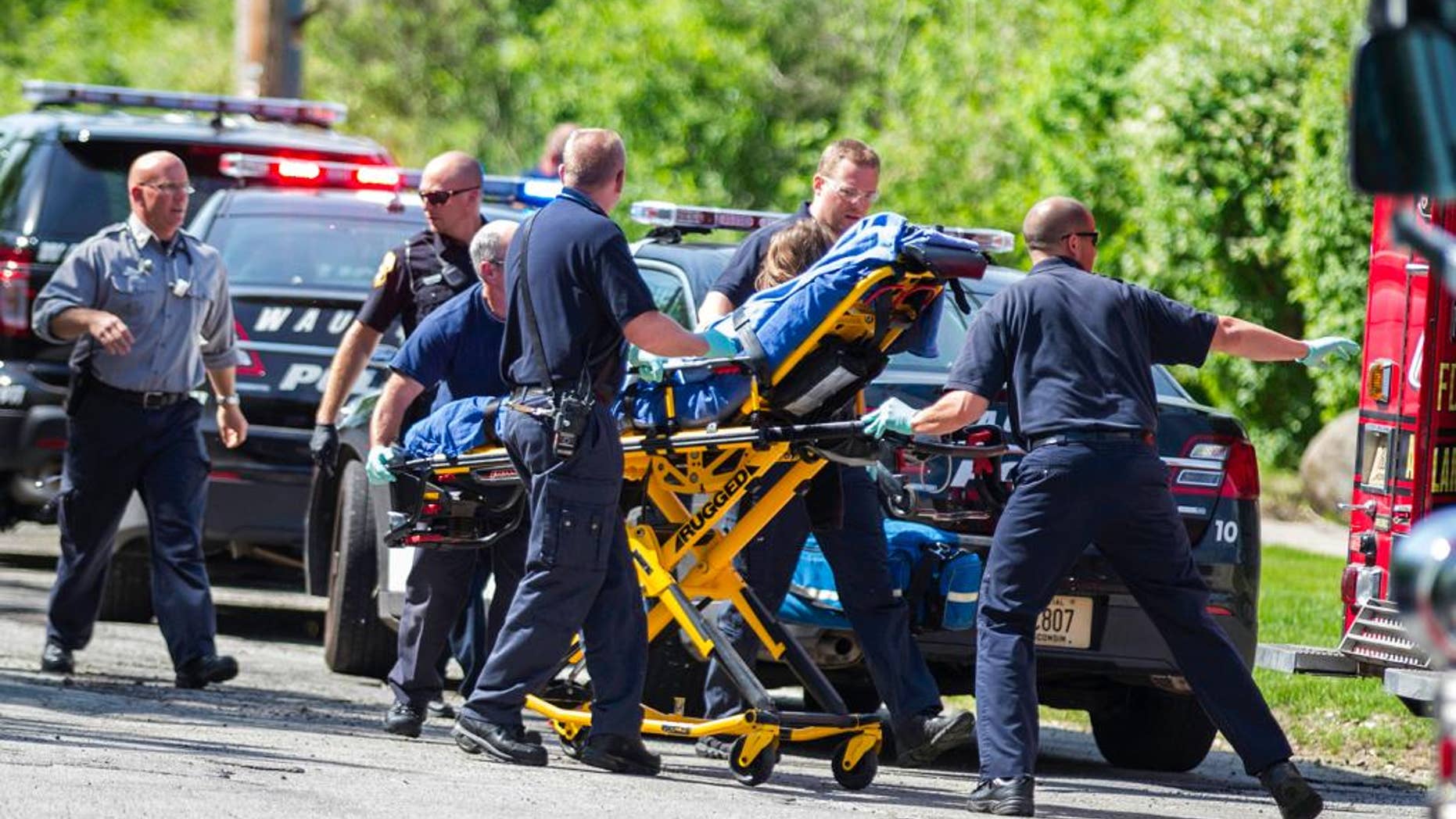 FILE - In this May 31, 2014 file photo, rescue workers take 12-year-old stabbing victim Payton Leutner to an ambulance in Waukesha, Wis. A Wisconsin state appeals court ruled July 27, 2016, that the two girls accused of trying to kill Leutner in an attempt to please the fictional horror character Slender Man should be tried as adults. The 2nd District Appeals court, in a pair of rulings, affirmed a lower court's determination that it was reasonable to try both girls as adults. The girls could appeal the rulings to the Wisconsin Supreme Court. (AP Photo/Abe Van Dyke, File)