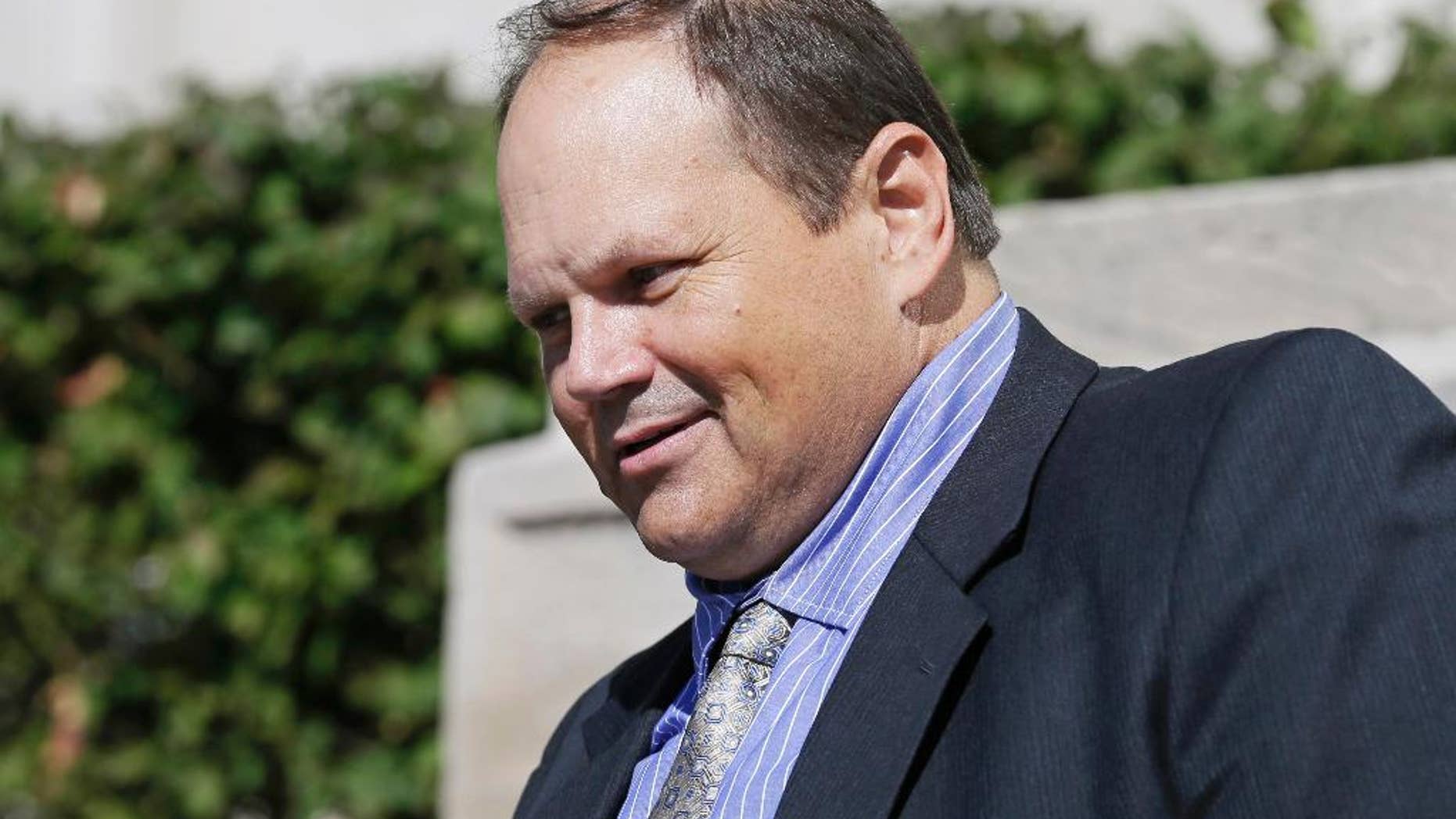 FILE - In this Sept. 9, 2015, file photo, former Multi-State Lottery Association security director Eddie Tipton leaves the Polk County Courthouse in Des Moines, Iowa, after his sentencing in a jackpot-fixing scandal. Tipton's attorney is arguing to the Iowa Court of Appeals that his client's conviction last year on fraud charges should be thrown out. Tipton, is appealing his July 2015 convictions related to fixing an Iowa Hot Lotto game in 2010, which resulted in a 10-year prison sentence. (AP Photo/Charlie Neibergall, File)