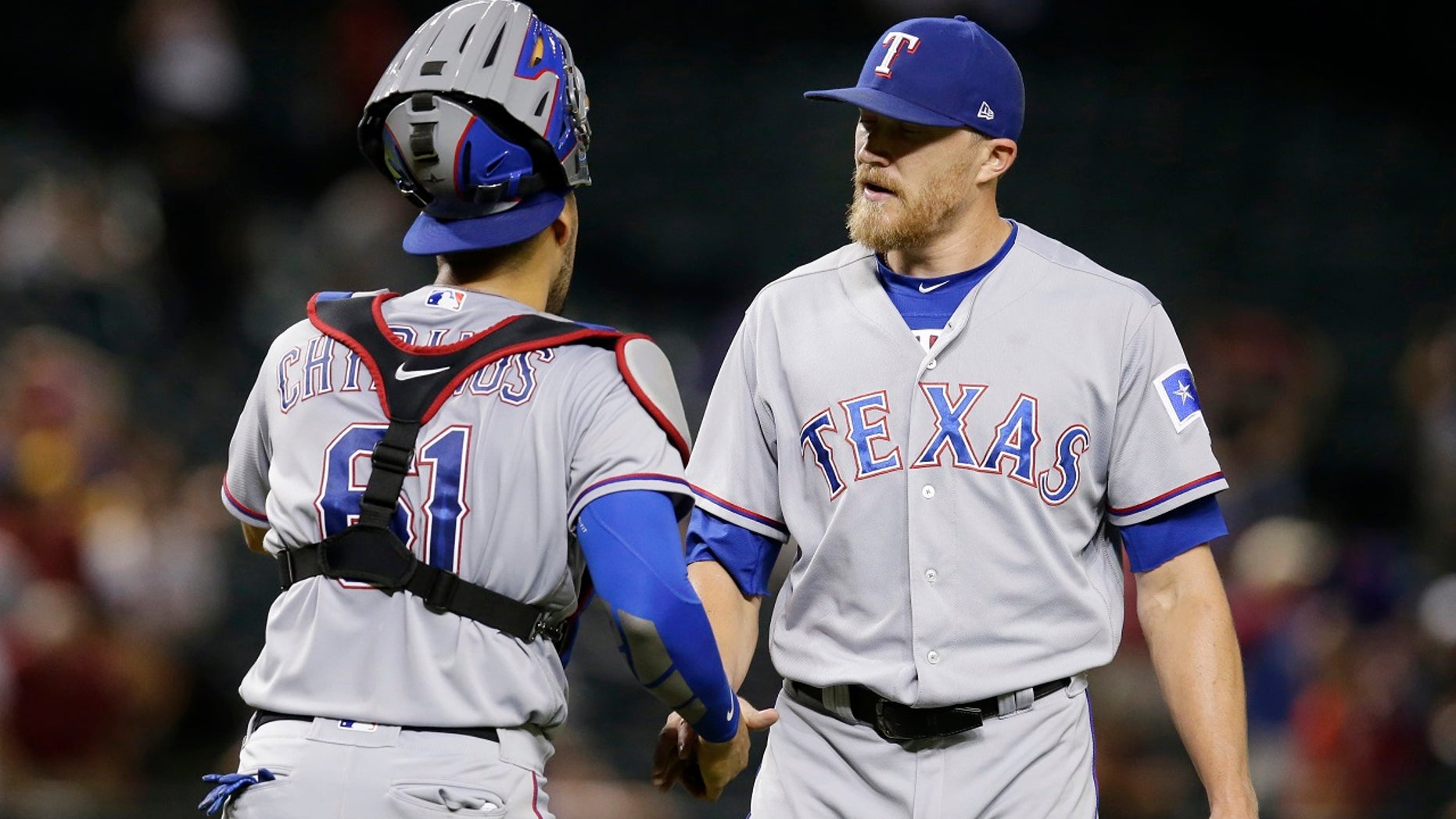 Texas Rangers pitcher Jake Diekman was traded to the Arizona Diamondbacks on Tuesday, and all he had to do was take a golf cart to the other side of Chase Field.