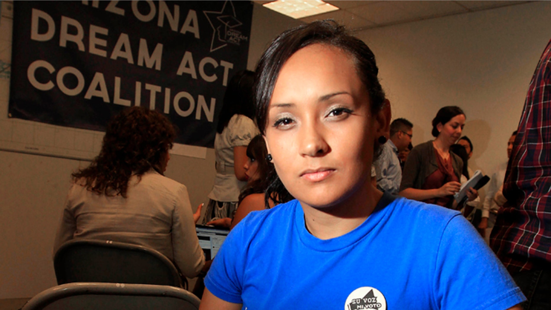 Erika Andiola poses for a portrait at a site where people line up to get guidance on Deferred Action.