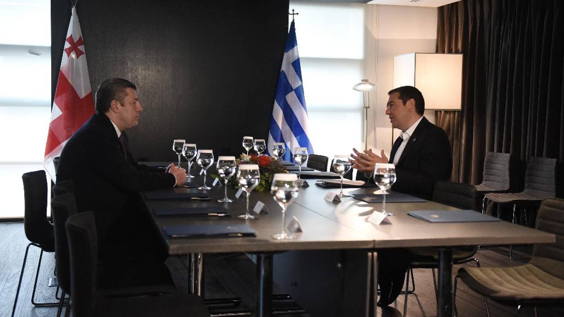 Greece's Prime Minister Alexis Tsipras, right, speaks with his Georgian Giorgi Kvirikashvili during their meeting in the northern Greek city of Thessaloniki, Tuesday, May 17, 2016. Tsipras and Kvirikashvili with other officials from Turkey, Bulgaria, Azerbaijan and Italy will participate in a ceremony of launch of the construction of Trans Adriatic Pipeline (TAP). (AP Photo/Giannis Papanikos)