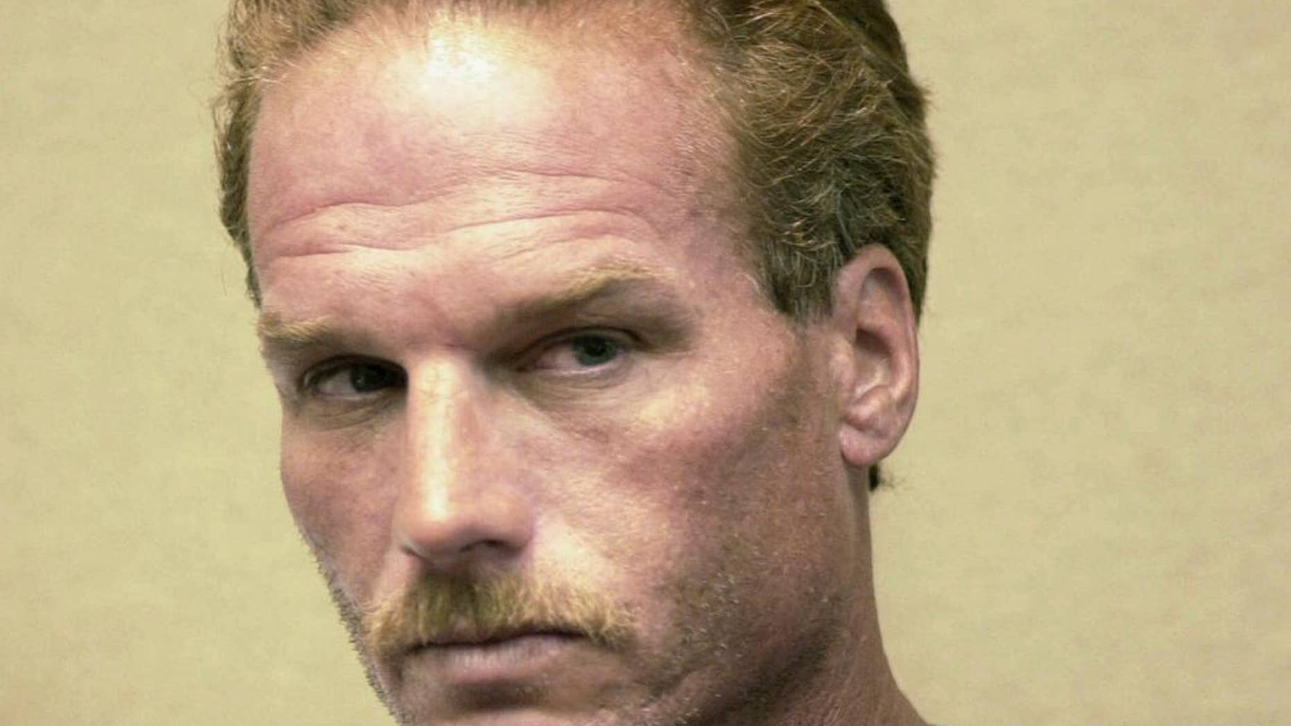 FILE - This Aug. 2, 2001, file photo shows Gary Sampson during arraignment in district court in Brockton, Mass. Sampson was sentenced to death in 2003 for the carjack killings of multiple men in 2001, but the sentence was overturned in 2011. A sentencing retrial for Sampson is scheduled to begin Wednesday, Sept. 14, 2016, in federal court in Boston. (AP Photo/The Patriot Ledger, Greg Derr, Pool, File)