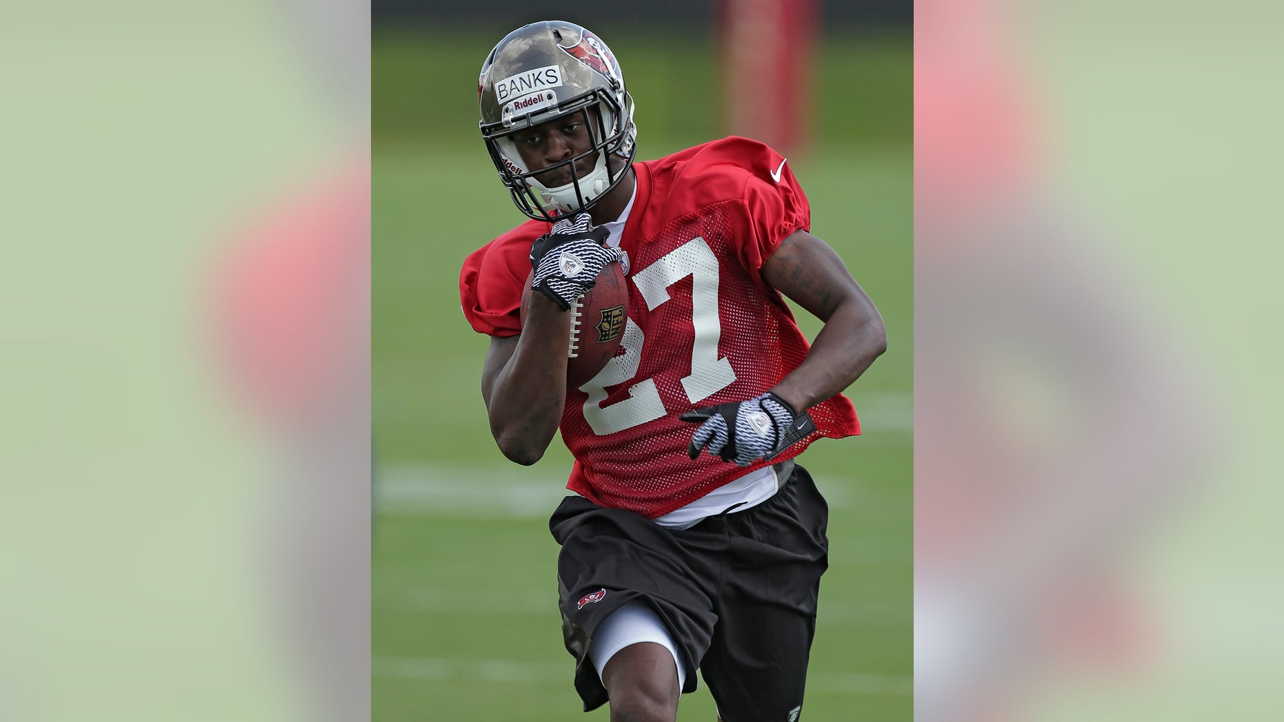 Tampa Bay Buccaneers cornerback Johnthan Banks runs with the ball during NFL football rookie minicamp Friday, May 3, 2013, in Tampa, Fla. Banks, from Mississippi State, was the Buccaneers second round pick. (AP Photo/Chris O'Meara)