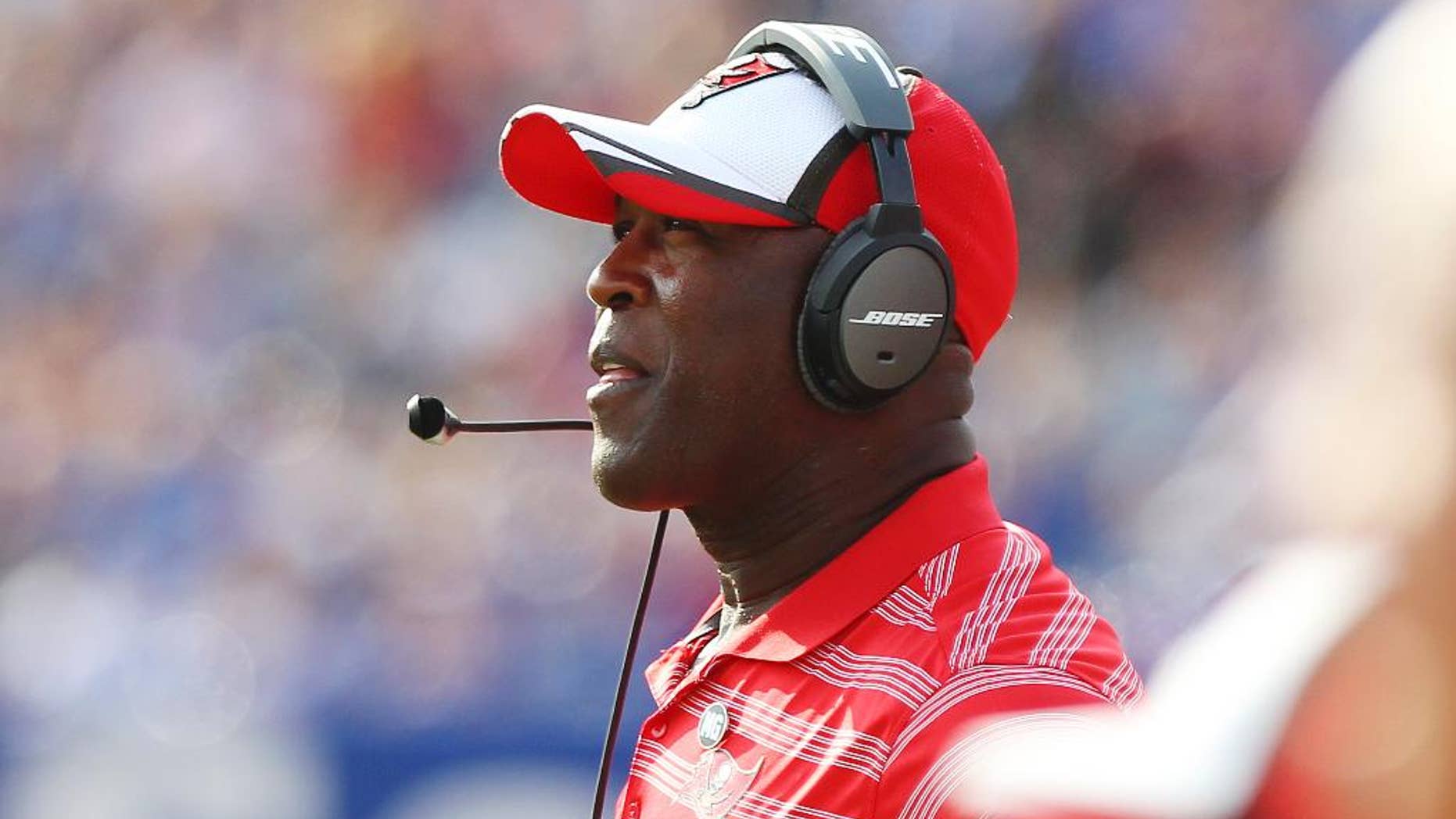 Tampa Bay Buccaneers head coach Lovie Smith watches his team play during the first half of a preseason NFL football game against the Buffalo Bills Saturday, Aug. 23, 2014, in Orchard Park, N.Y. The Buccaneers won the game 27-14. (AP Photo/Bill Wippert)