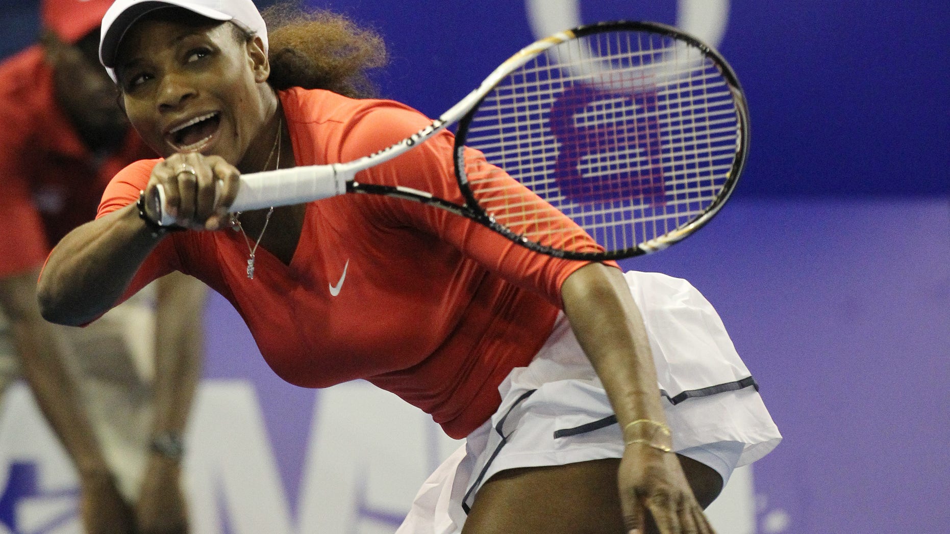 FILE - In this Nov. 4, 2012, file photo, Serena Williams of the U.S. returns a serve from sister Venus during an exhibition tennis match at Ellis Park Indoor Arena in Johannesburg, South Africa. Williams has had surgery on her big toes and withdrew from an exhibition match against top-ranked Victoria Azarenka in Thailand in December. A medical certificate from Florida podiatrist Jeffrey Rockefeller says Williams "was treated for a chronic foot disorder which involved minor procedures on both of her great toes." (AP Photo/Themba Hadebe, File)
