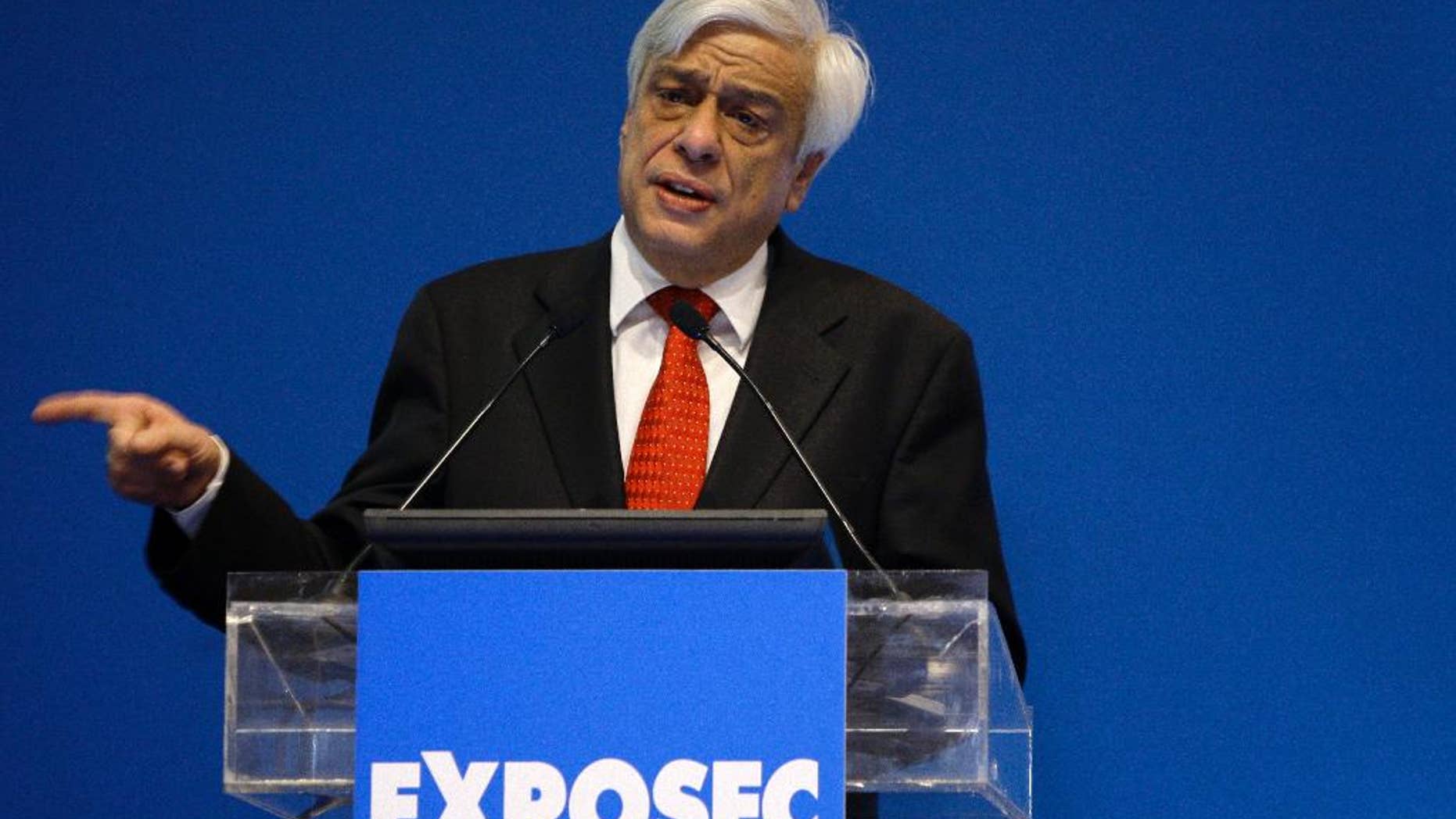 FILE - In this photo taken on Tuesday, March 17, 2009, Greek Interior Minister Prokopis Pavlopoulos speaks during Exposec international security conference, in Zappeion hall, Athens. Greece's Prime Minister Alexis Tsipras announced on Tuesday, Feb. 17, 2015 that his party would endorse former conservative interior minister Prokopis Pavlopoulos as candidate for the country's new president. (AP Photo/Petros Giannakouris, File)