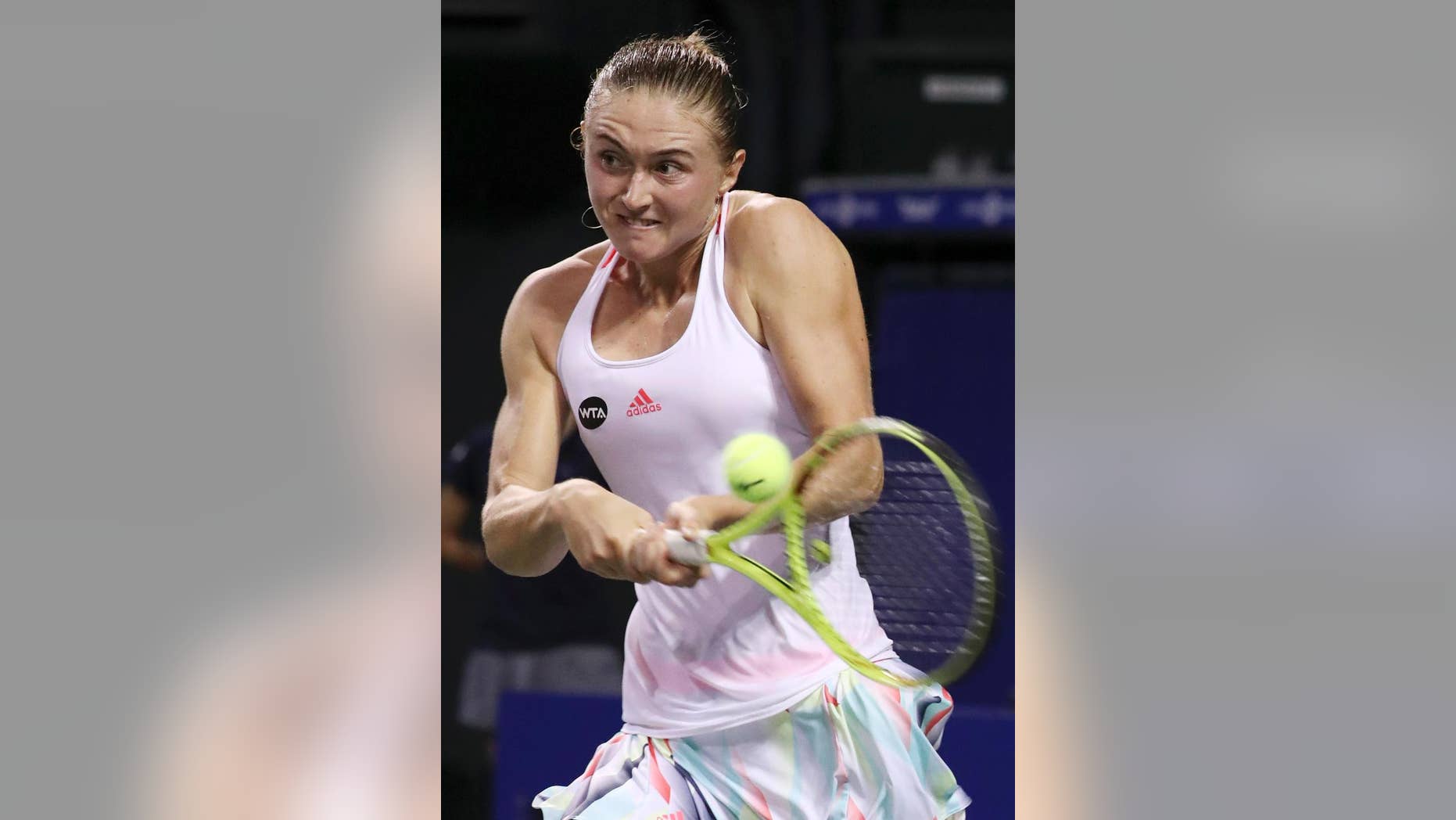FILE In this file photo taken on Thursday, Sept. 22, 2016, Aliaksandra Sasnovich, of Belarus, returns a shot against Karolina Pliskova, of the Czech Republic, during the women's singles match at the Pan Pacific Open women's tennis tournament in Tokyo, Japan. Sasnovich is ranked 104 places below Dutch world No. 24 Kiki Bertens, but didn't let it show as she broke Bertens' serve seven times in a 6-3, 6-4 win, Sunday, Feb. 12, 2017. (AP Photo/Eugene Hoshiko, file)