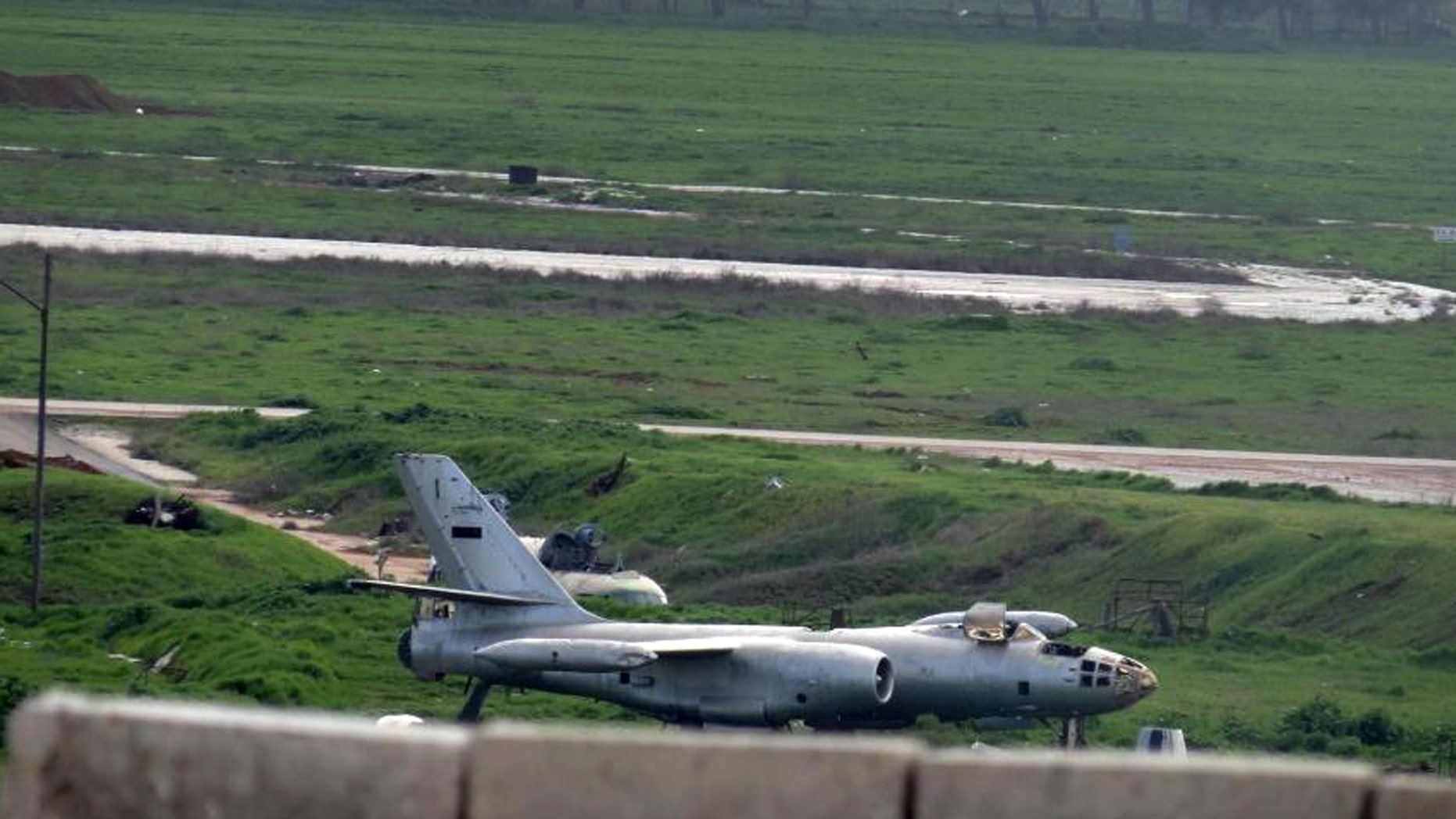Citizen journalism image taken on Thursday, Feb. 14, 2013 and provided by Aleppo Media Center, AMC, which has been authenticated based on its contents and other AP reporting, shows Nairab air base in Aleppo province, Syria. Earlier this week, rebels launched a major attack on the Aleppo International Airport and the nearby air base of Nairab capturing most of the "Brigade 80" force that is in charge of protecting the area. Activists says scores of soldiers and rebels were killed in the battle this week. (AP Photo/Aleppo Media Center AMC)