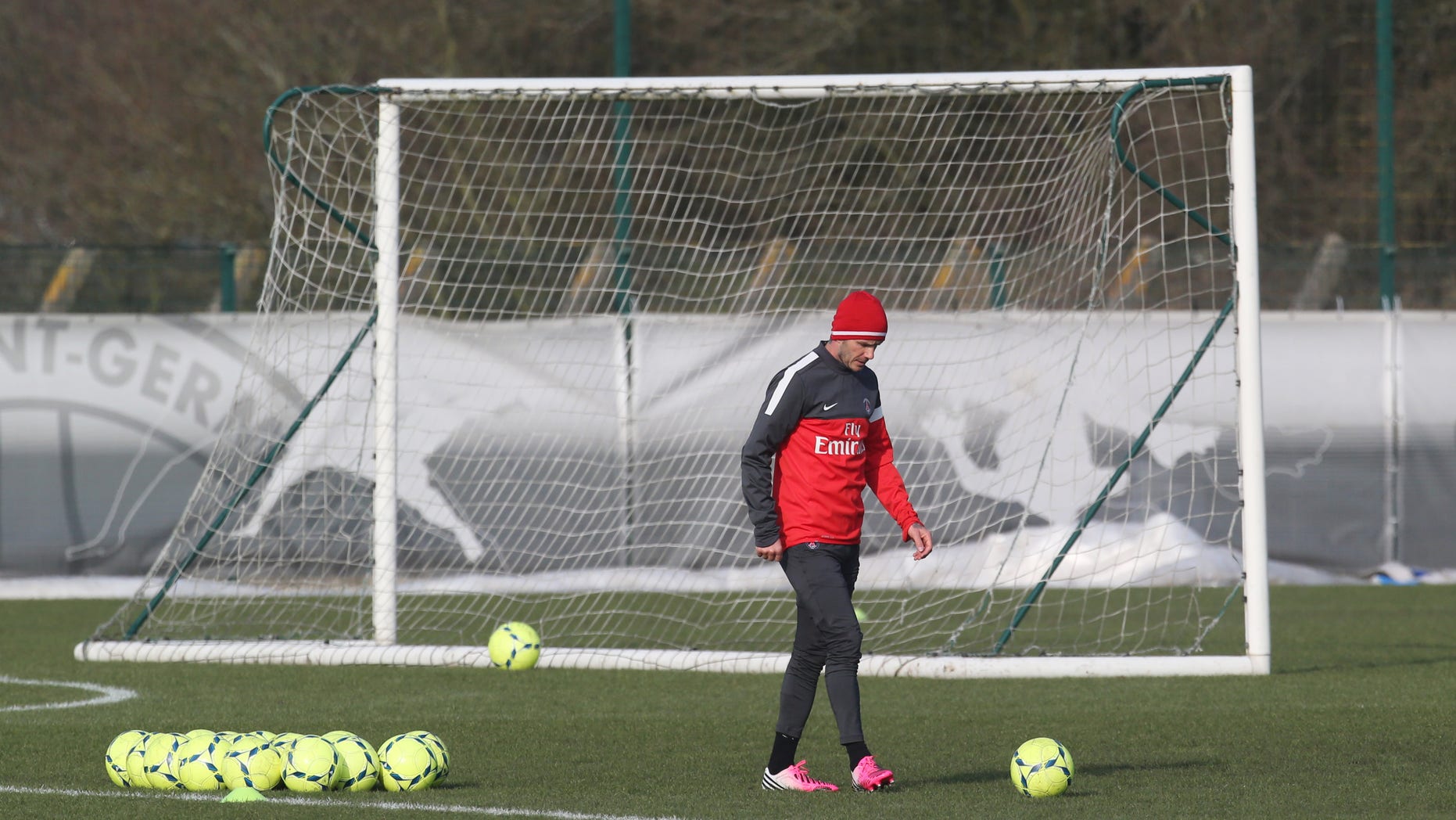 David Beckham is seen during a practice session with Paris Saint-Germain soccer team in Saint-Germain-en-Laye, west of Paris, Wednesday, Feb. 13, 2013. David Beckham started his first practice session with Paris Saint-Germain on Wednesday amid a media frenzy as dozens of camera crews and photographers jostled for position at the club's training ground in the western suburbs of Paris. (AP Photo/Michel Euler)