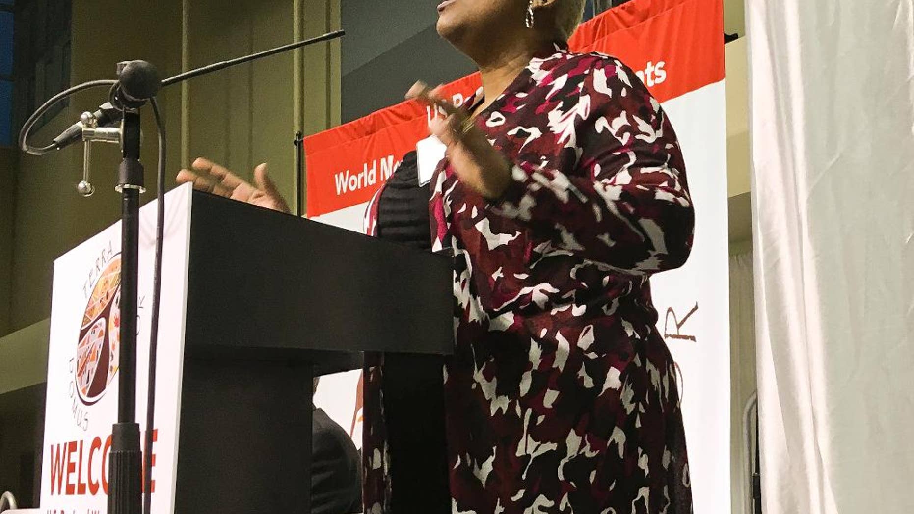 Trena Turner, pastor of the non-denominational Victory in Praise Church in Stockton, opens a four-day conference on economic inequality in Modesto, Calif., Thursday, Feb. 16, 2017. The Vatican is bringing its conversation on economic inequality to California's Central Valley. It comes at a time when the world is grappling with an America-first agenda and to a place where the economy is poor and relies on migrant labor. The four-day conference is an offshoot of global meetings launched by Pope Francis nearly three years ago to explore the "economy of exclusion." (AP Photo/Janie Har)