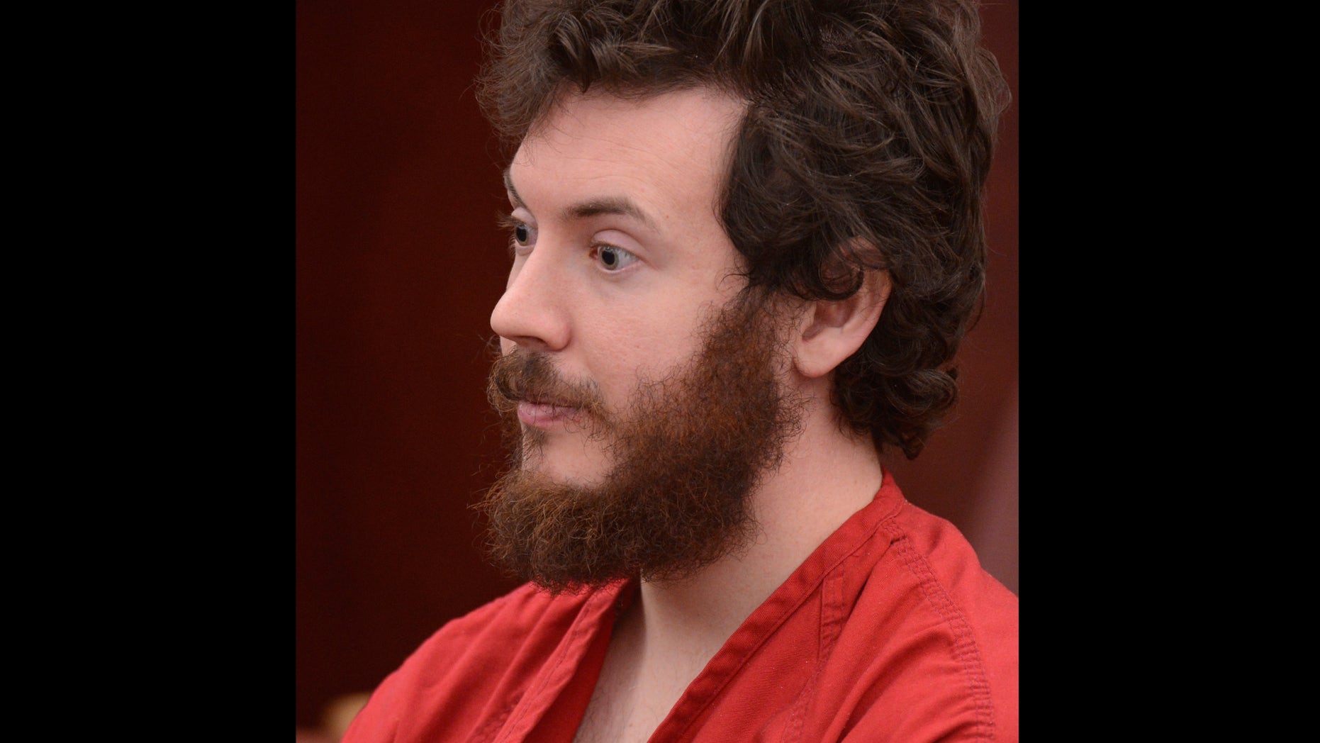 FILE - James Holmes, Aurora theater shooting suspect, sits in the courtroom during his arraignment in Centennial, Colo., in a Tuesday, March 12, 2013 file photo. Holmes' lawyers plans to ask a judge on Monday, May 13, 2013 to enter a plea of not guilty by reason of insanity, a move that is widely seen as Holmes' best hope of avoiding the death penalty. (AP Photo/Denver Post, RJ Sangosti, Pool, File)
