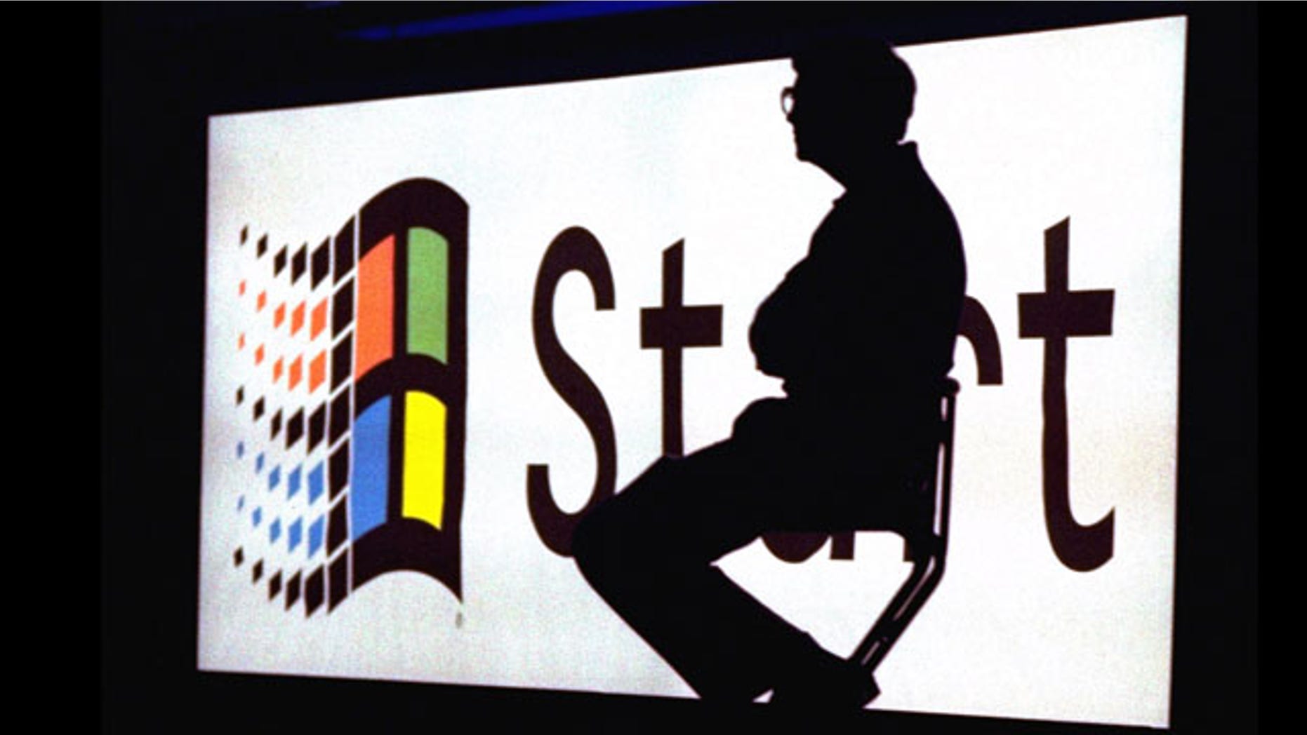 Microsoft Chairman Bill Gates sitting on stage during a video portion of the Windows 95 Launch Event, on the company's campus in Redmond, Washington.