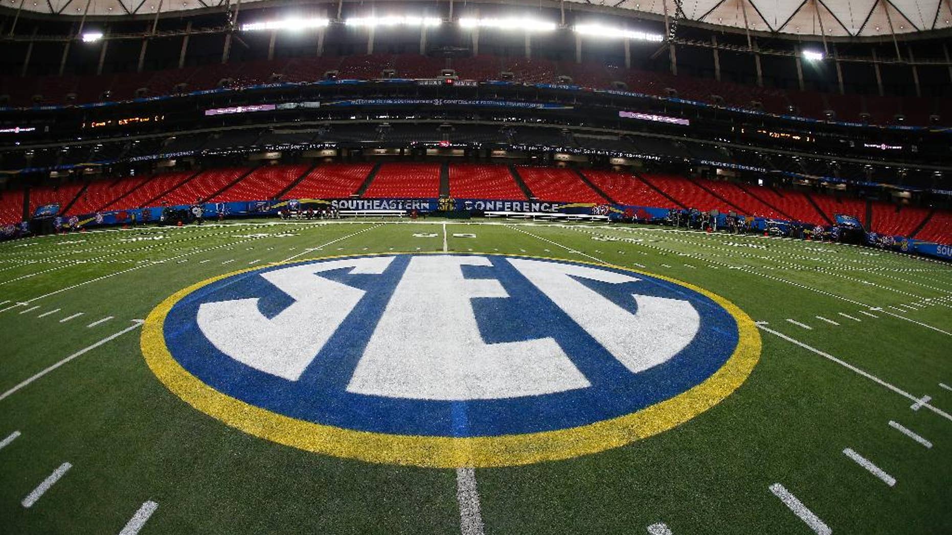 The SEC logo is seen Friday, Dec. 5, 2014, in Atlanta, ahead of the Southeastern Conference championship football game between Alabama and Missouri held Saturday. (AP Photo/John Bazemore)