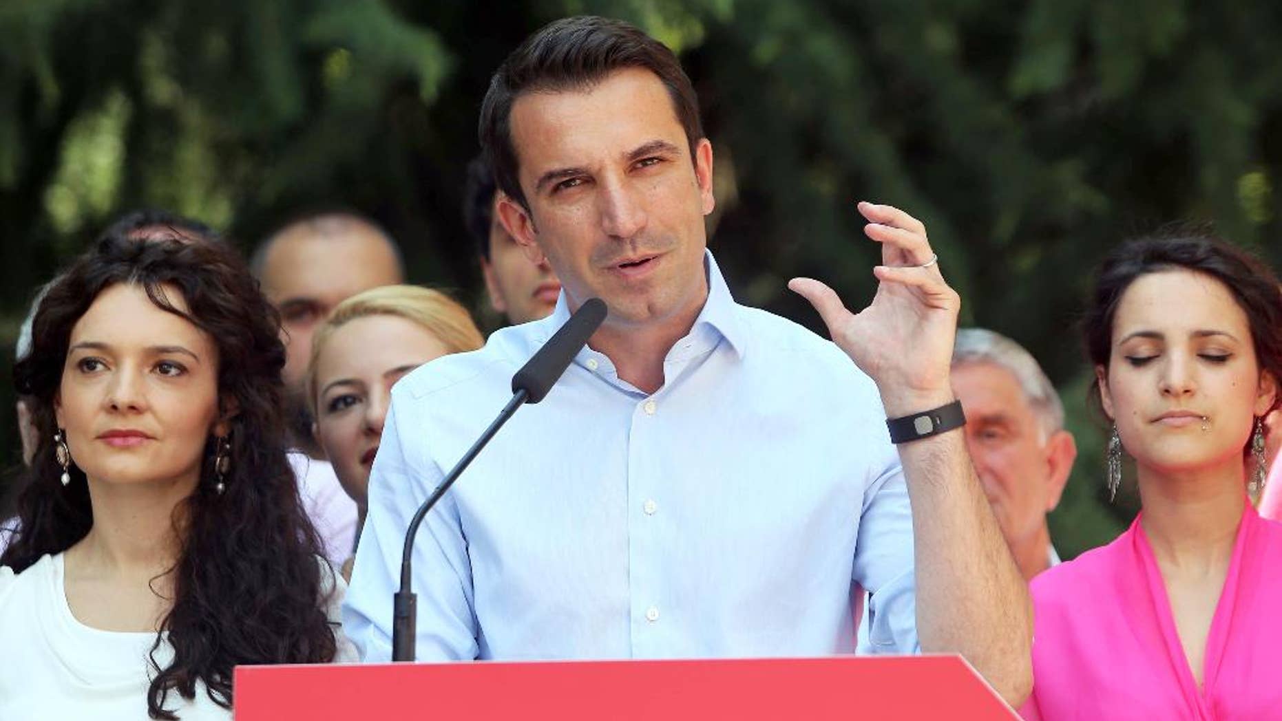 Erion Veliaj of the governing left wing Socialist Party-led coalition speaks to supporters after being elected as Tirana’s new mayor Tuesday, June 23, 2015. The post was kept from the main opposition Democratic Party leader Lulzim Basha, and is seen as key in boosting Albania's bid to launch membership negotiations with the European Union. (AP Photo/Hektor Pustina)