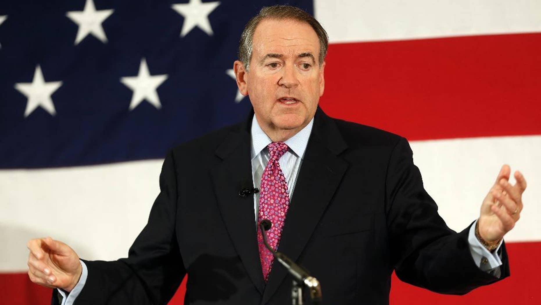 FILE - In this April 18, 2015 file photo, former Arkansas Republican Gov. Mike Huckabee speaks at the Republican Leadership Summit in Nashua, N.H. Huckabee is set to announce he will seek the 2016 Republican presidential nomination. He has an event planned for May 5 in his hometown of Hope, Ark., where former President Bill Clinton was also born. (AP Photo/Jim Cole, File)