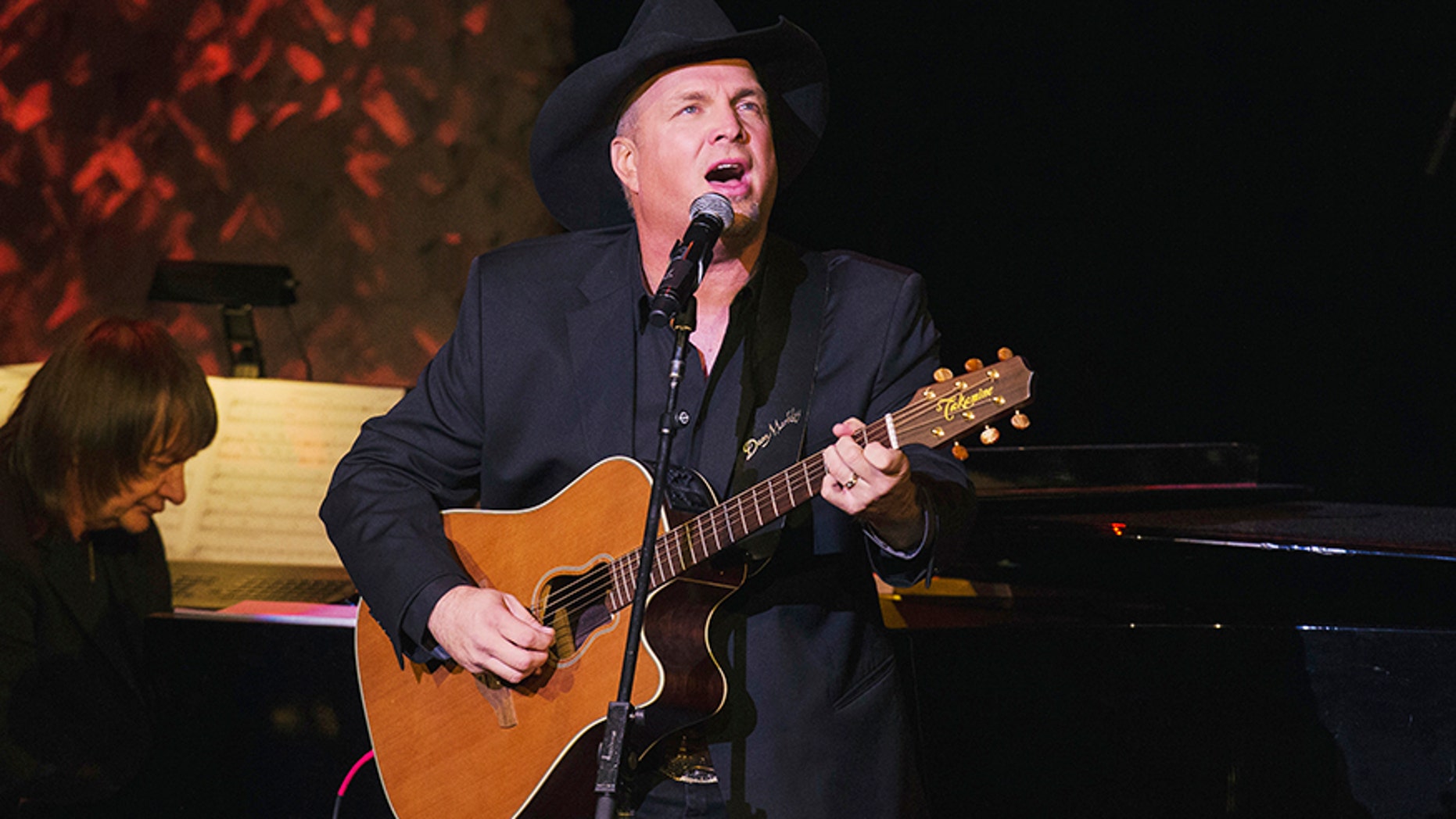 Nov. 17, 2014: Singer and songwriter Garth Brooks performs after accepting an award at the American Society of Composers, Authors and Publishers Centennial Awards in New York.