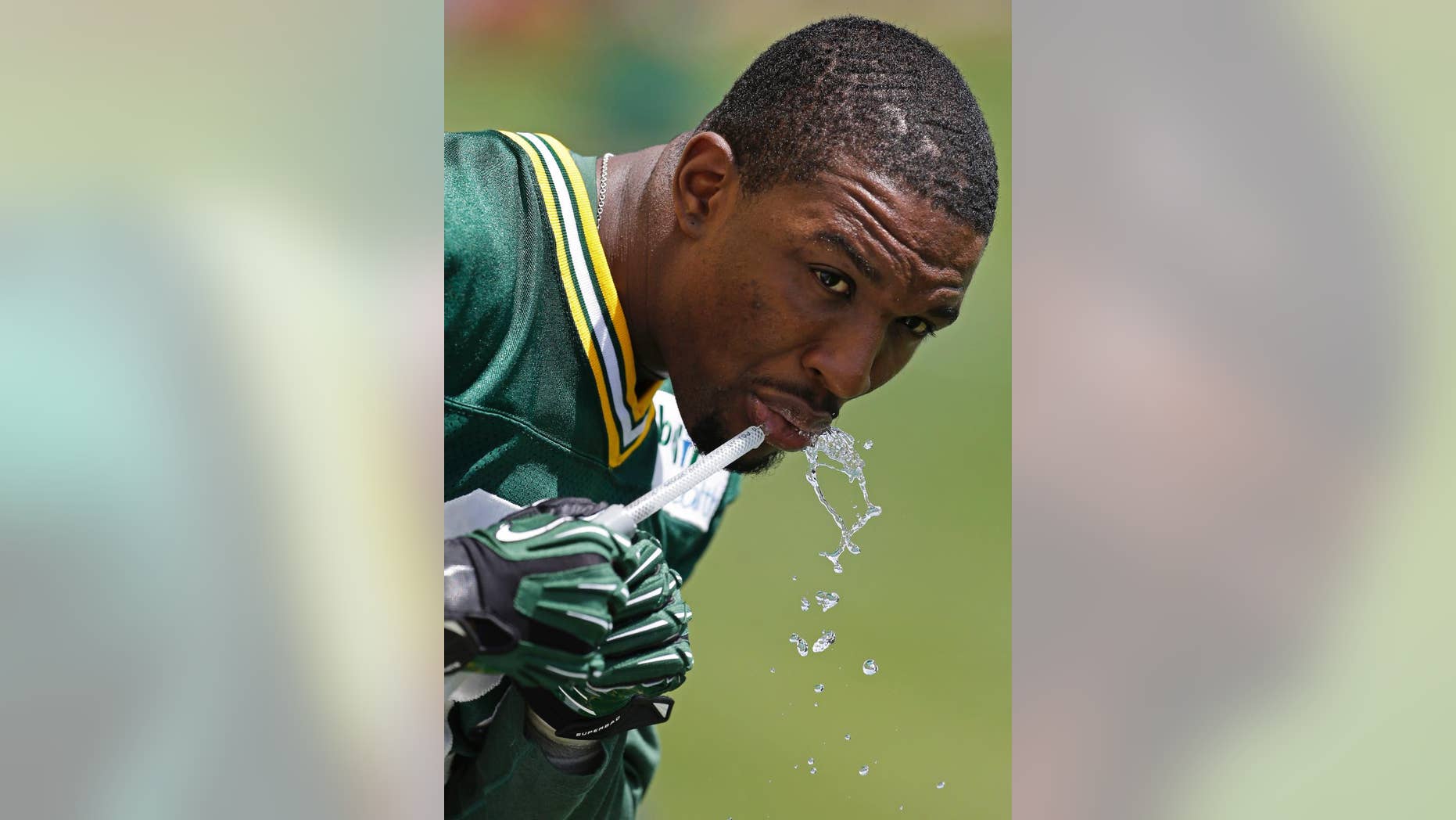 Green Bay Packers Demetri Goodson get a drink during NFL football minicamp Tuesday, June 17, 2014, in Green Bay, Wis. (AP Photo/Mike Roemer)