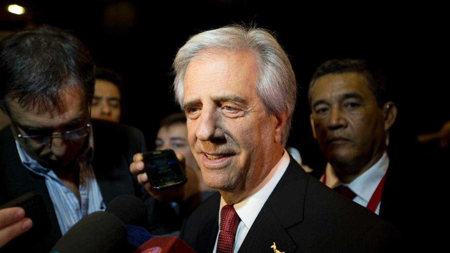Uruguay's President Tabare Vazquez speaks to reporters as he arrives to the CEO Summit of the Americas in Panama City, Friday, April 10, 2015. The second CEO Summit organized by Panama's government and the Inter-American Development Bank, gathers business and political leaders, just before the start of the VII Summit of the Americas. (AP Photo/Moises Castillo)