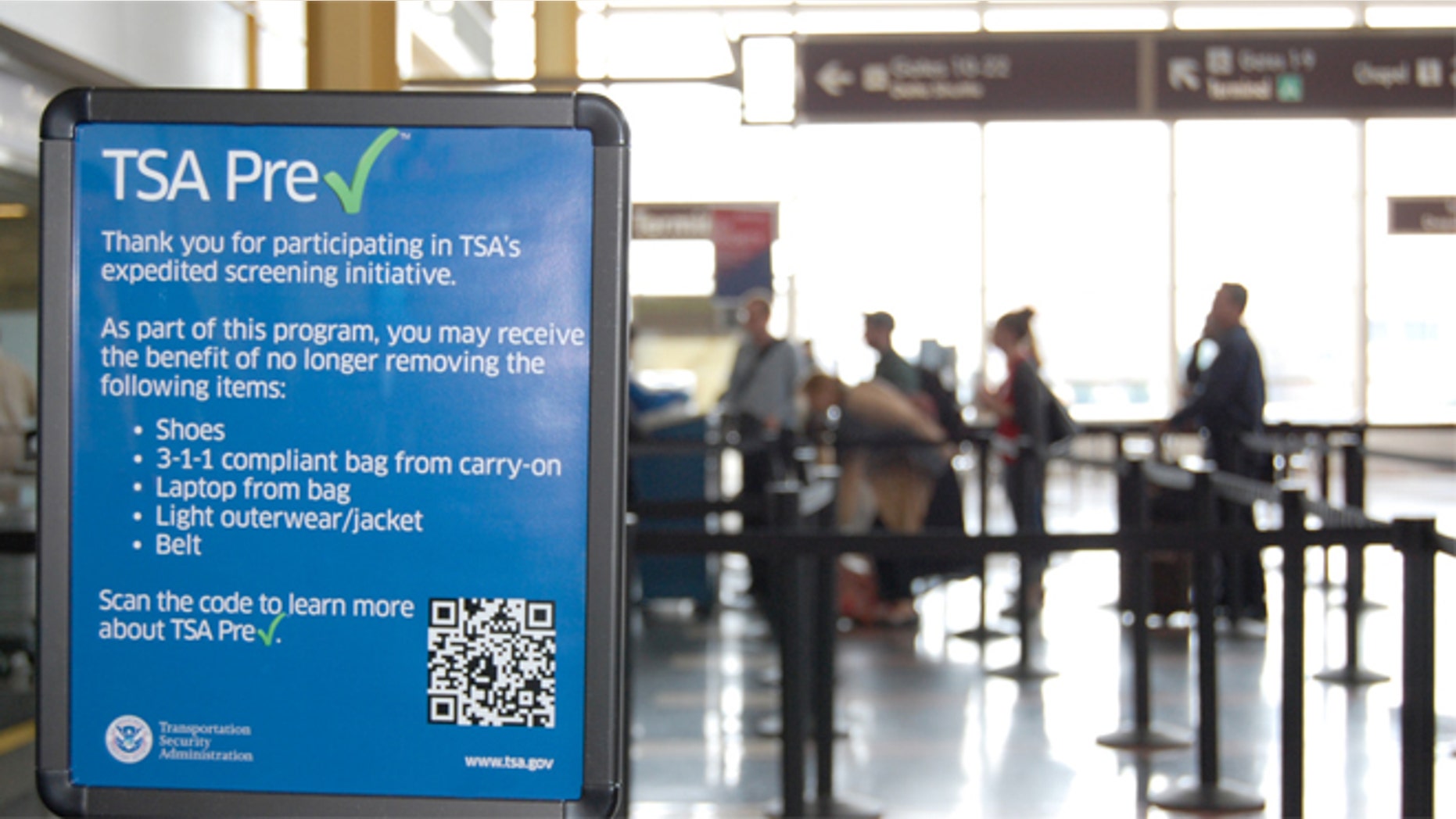 A sign listing the benefits of the TSA PreCheck security program. (AP)
