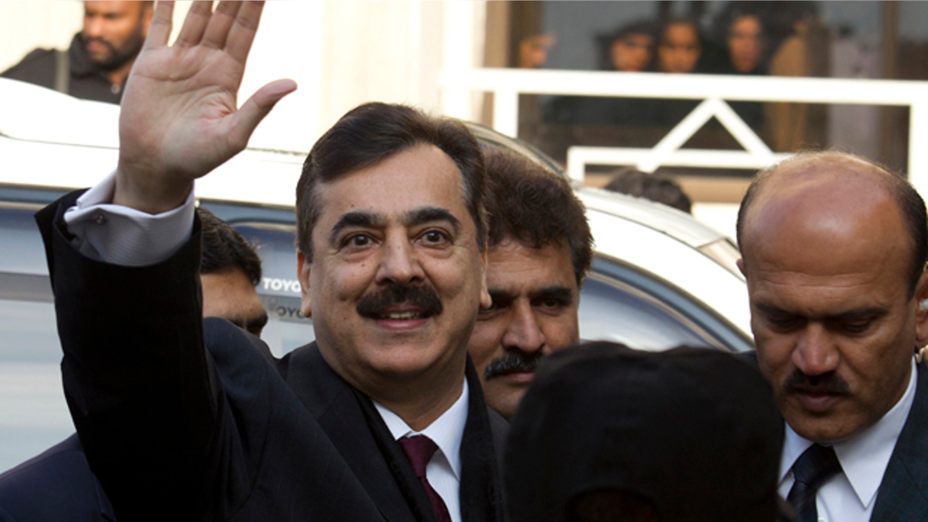 Jan. 19: Pakistani Prime Minister Yousuf Raza Gilani waves at the Supreme Court in Islamabad.