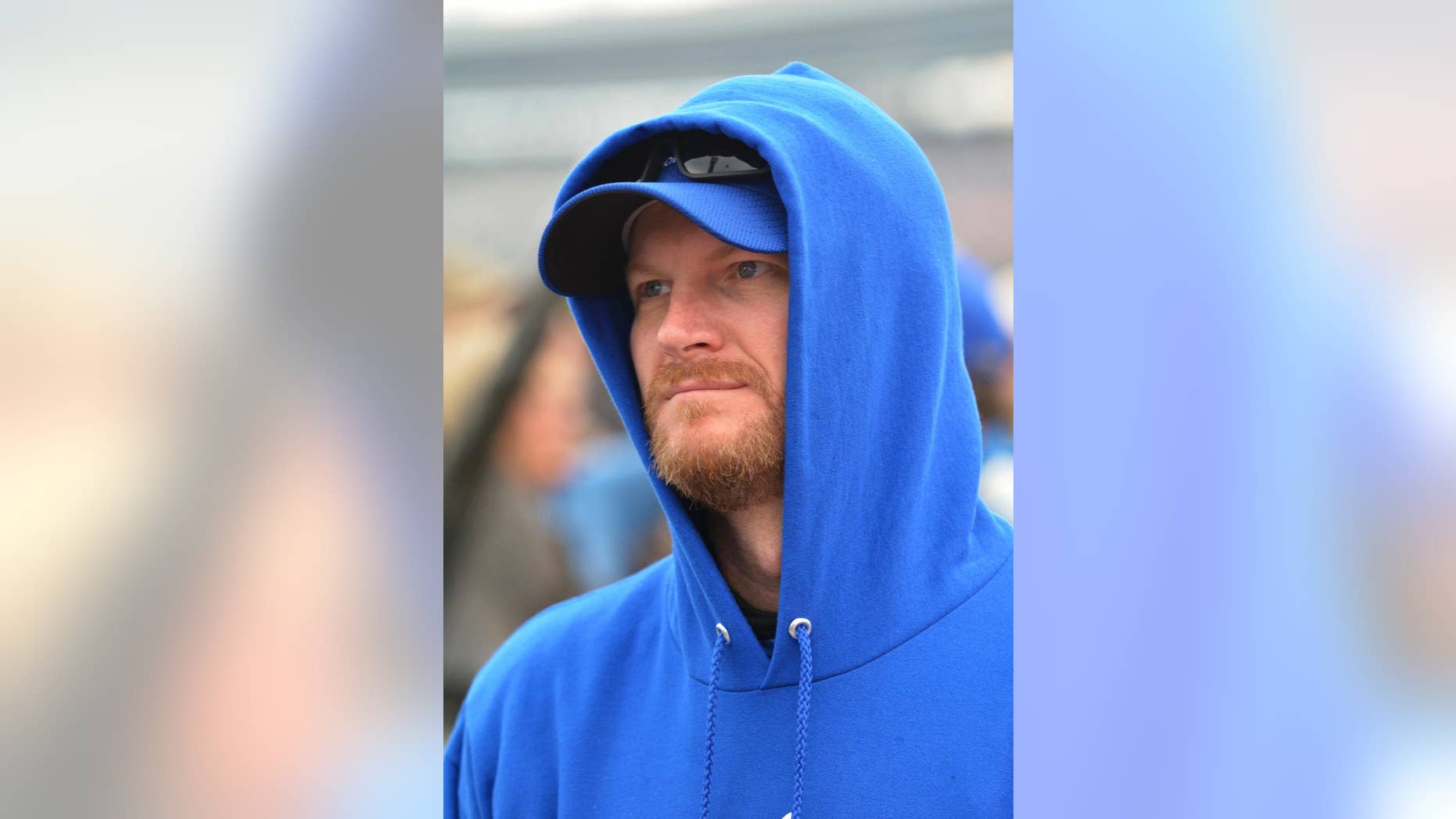 Dale Earnhardt Jr. stands on the track before the NASCAR Sprint Cup Series auto race at Texas Motor Speedway in Fort Worth, Texas, Saturday, April 9, 2016. (AP Photo/Randy Holt)