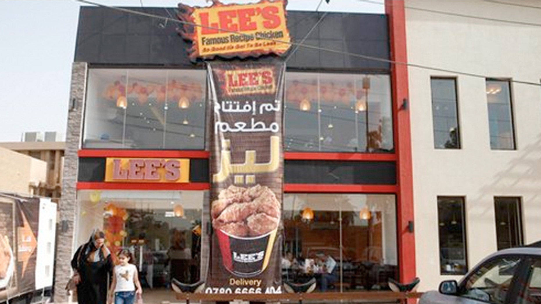 Thursday, Aug. 23, 2012: Customers leave Lee's restaurant in Baghdad, Iraq.