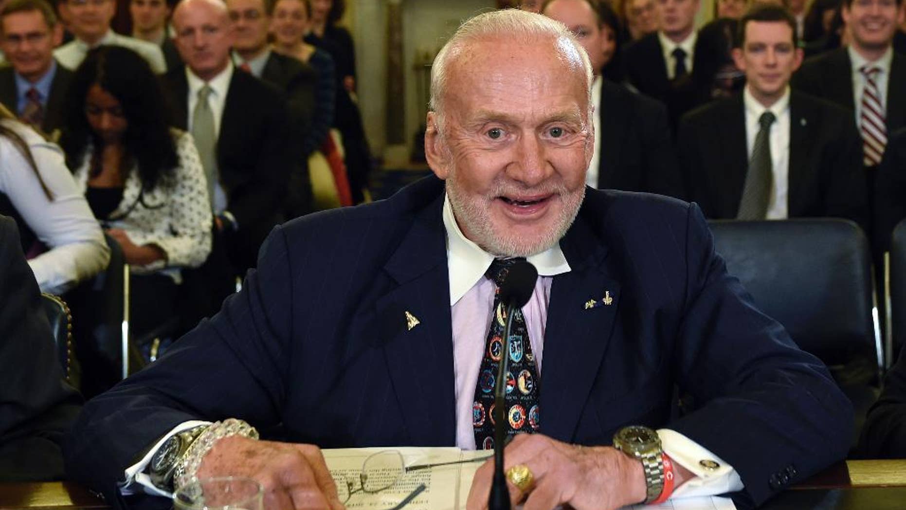 FILE - In this Tuesday, Feb. 24, 2015, file photo, Buzz Aldrin, former NASA Astronaut and Apollo 11 Pilot, prepares to testify on Capitol Hill in Washington, before the Senate subcommittee on Space, Science, and Competitiveness hearing on human exploration goals and commercial space competitiveness. Officials said Aldrin, one of the first men to walk on the moon, has been evacuated by plane from the South Pole for medical reasons. An association of Antarctica tour operators said Thursday, Dec. 1, 2016, that Aldrin was visiting the South Pole as part of a private tourist group when his health deteriorated. (AP Photo/Susan Walsh, File)