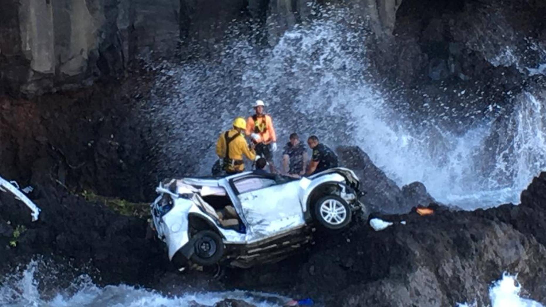 Rescue workers respond to the scene of a car crash in Hawaii.