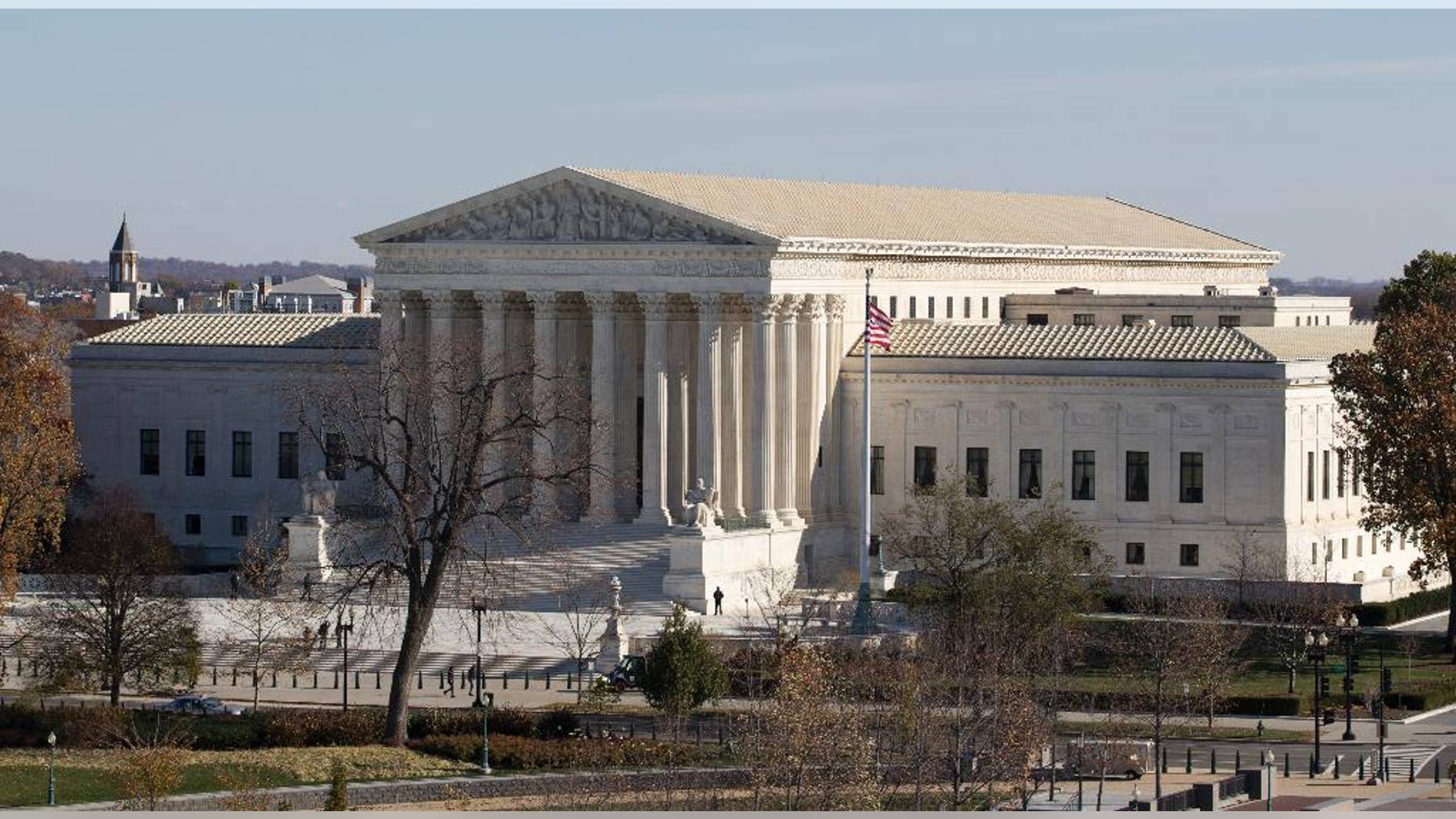 FILE - This Nov. 18, 2014, file photo shows the U.S. Supreme Court in Washington, as seen from the roof of the U.S. Capitol. Anthony Elonis claimed he was just kidding when he posted a series of graphically violent rap lyrics on Facebook about killing his estranged wife, shooting up a kindergarten class and attacking an FBI agent. But his wife didn't see it that way. Neither did a federal jury. In a far-reaching case that probes the limits of free speech over the Internet, the Supreme Court on Monday is considering whether Elonis' Facebook posts, and others like it, deserve protection under the First Amendment. (AP Photo/Carolyn Kaster, File)