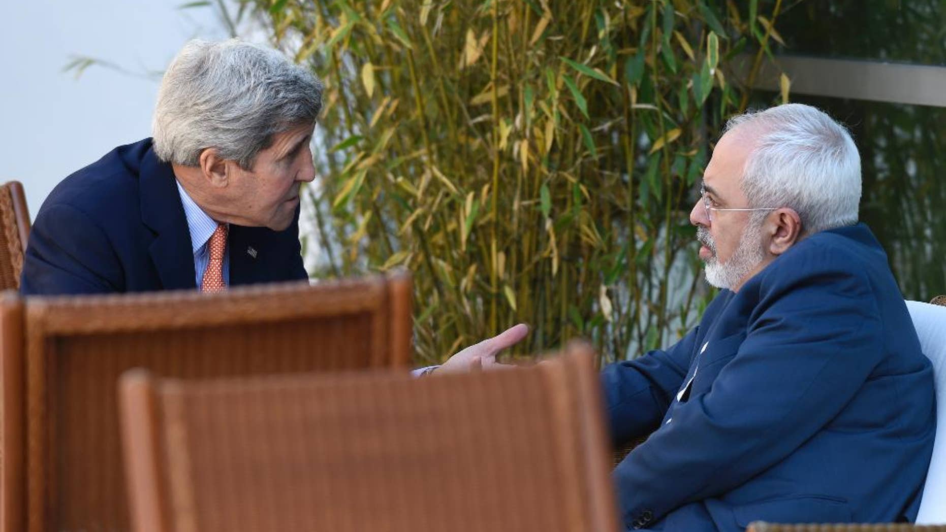 FILE -- May 30, 2015: Secretary of State John Kerry, left, talks with Iranian Foreign Minister Mohammad Javad Zarif, in Geneva, Switzerland.