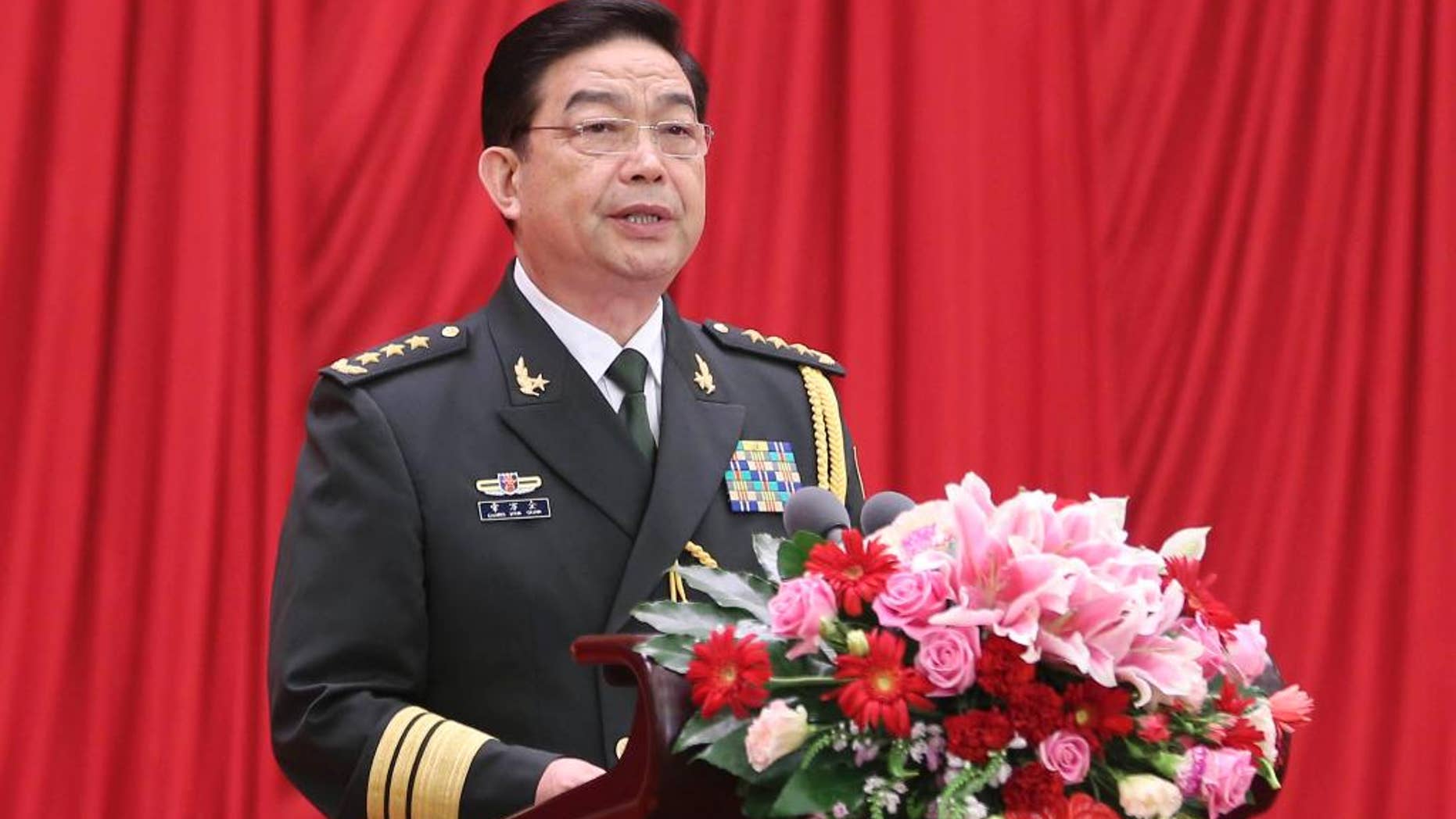 In this Sunday, July 31, 2016 photo released by China's Xinhua News Agency, Chinese Defense Minister Chang Wanquan addresses a reception held by the Ministry of National Defense to celebrate the 89th anniversary of the founding of the Chinese People's Liberation Army (PLA) in Beijing. China has reiterated its commitment to defending its sovereignty amid new tensions over its territorial and maritime claims in the South China Sea. Chang told the reception on Sunday that China would firmly safeguard its "state sovereignty, national security and development interests." "Territorial integrity and maritime rights and interests will be defended,” Chang was cited as saying by the official Xinhua News Agency. (Ding Lin/Xinhua News Agency via AP) NO SALES