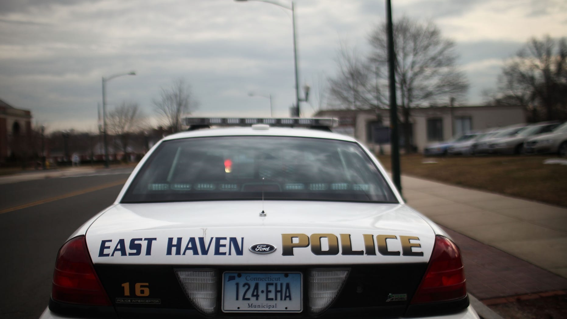EAST HAVEN, CT - FEBRUARY 01: An East Haven Police car is viewed on February 1, 2012 in East Haven, Connecticut. Following an investigation by the FBI, four East Haven police officers were arrested last week and accused of abusing Latinos in the working class community of 28,000 people which was nearly predominately white a generation ago. A recent civil rights investigation which was released last month revealed a pattern of discriminatory policing East Haven and the town has been warned by the U.S. Justice Department to make reforms. The arrested officers have been accused of subjecting Hispanics to beatings and false arrests among other things. Currently East Haven's Latino population is around 10 percent. (Photo by Spencer Platt/Getty Images)