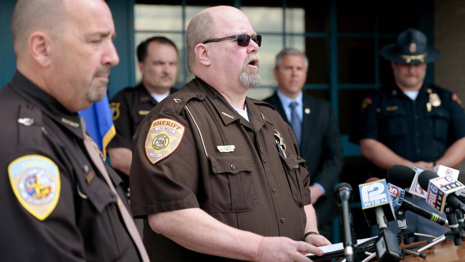 Columbia County Sheriff Dennis Richards updating reporters on the suspected gunman.