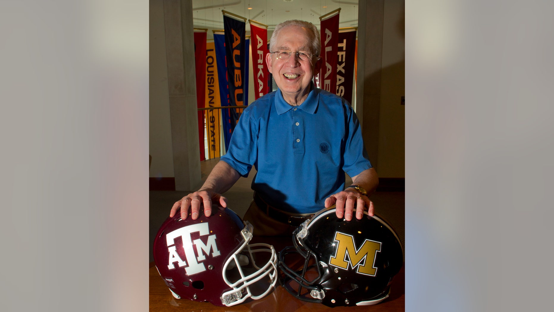 FILE - In this July 12, 2012, file photo, Southeastern Conference Commissioner Mike Slive poses for a photo at the SEC headquarters in Birmingham, Ala. Slive has checked off two huge items from his to-do list: completing the admission of Missouri and Texas A&M and cutting a deal for an SEC Network. (AP Photo/Dave Martin, File)