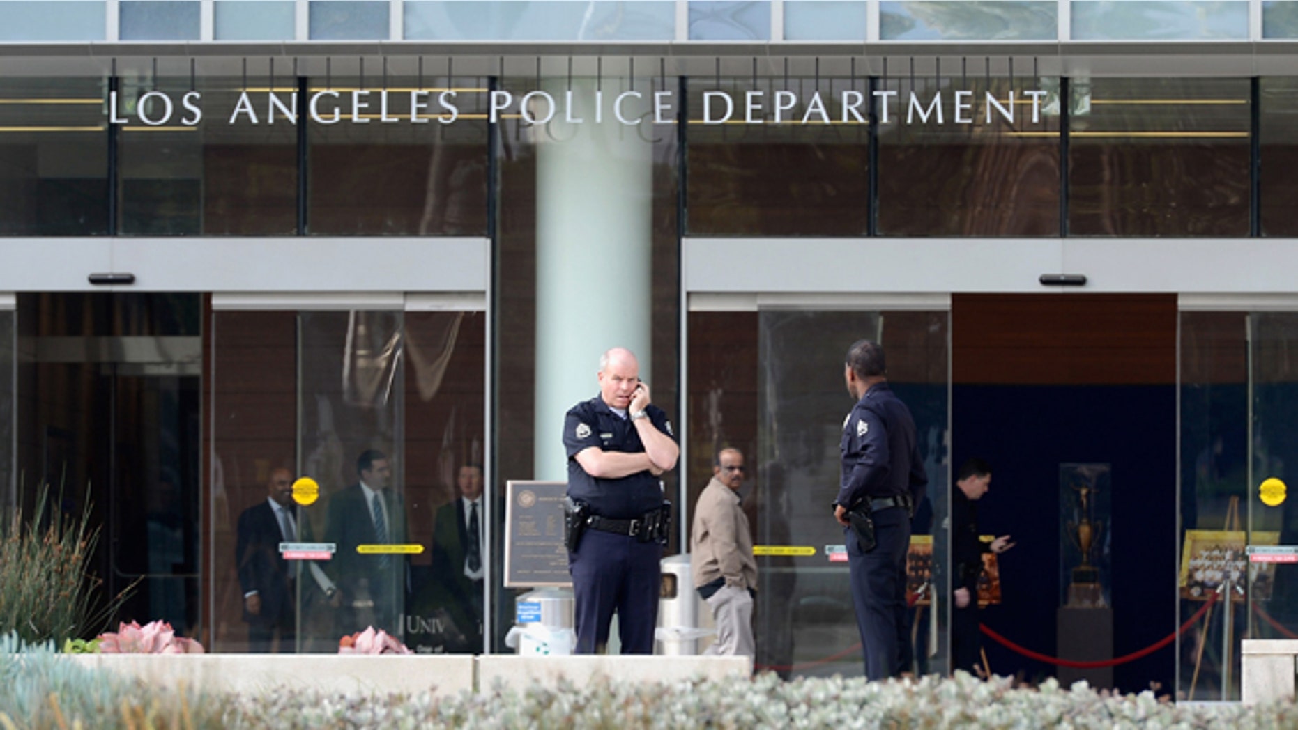 LAPD officers are deployed around the police headquarters on February 7, 2013 in Los Angeles.