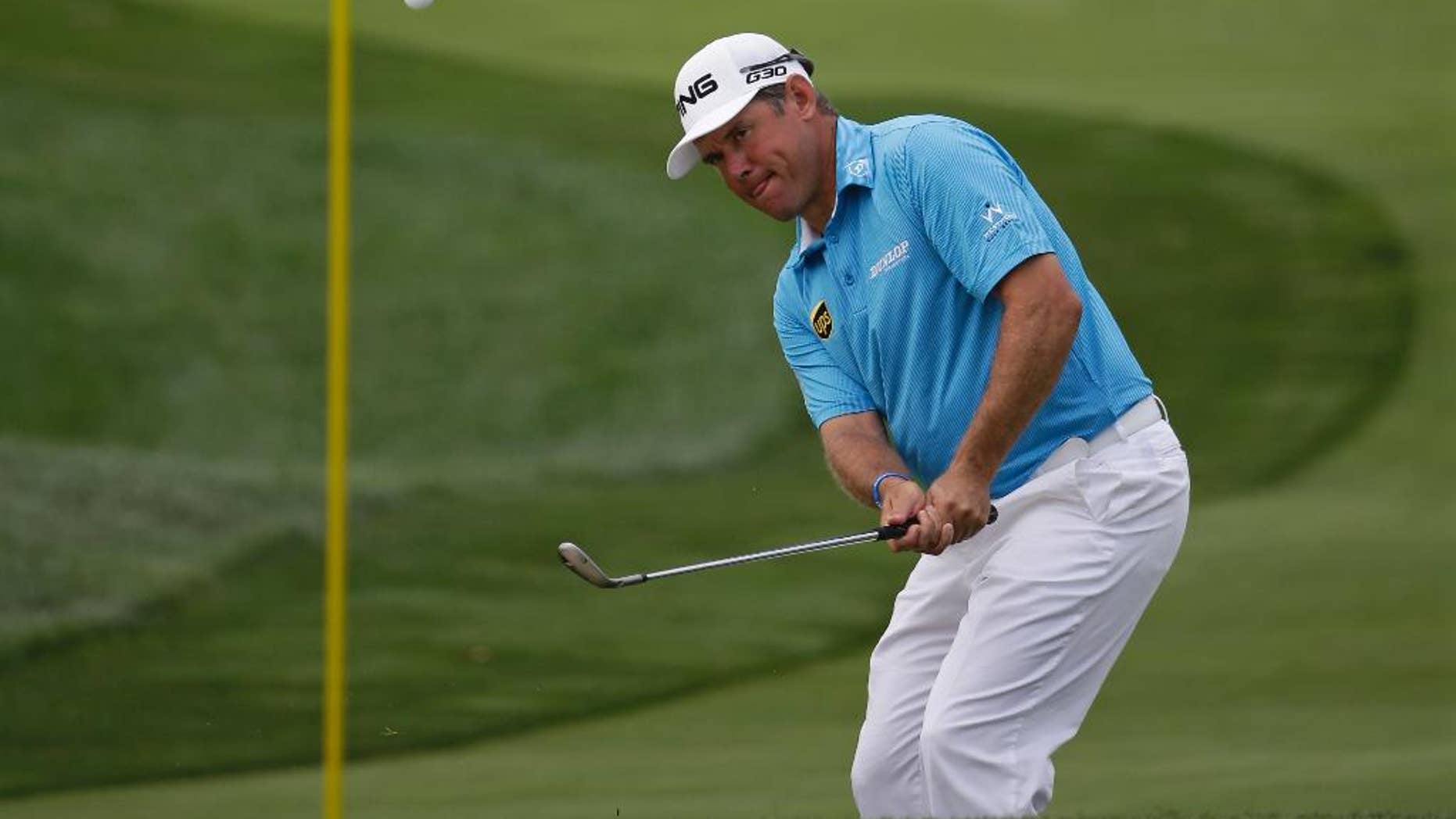 Lee Westwood, of England, hits a chip on the first hole during the first round of the PGA Championship golf tournament at Valhalla Golf Club on Thursday, Aug. 7, 2014, in Louisville, Ky. (AP Photo/David J. Phillip)