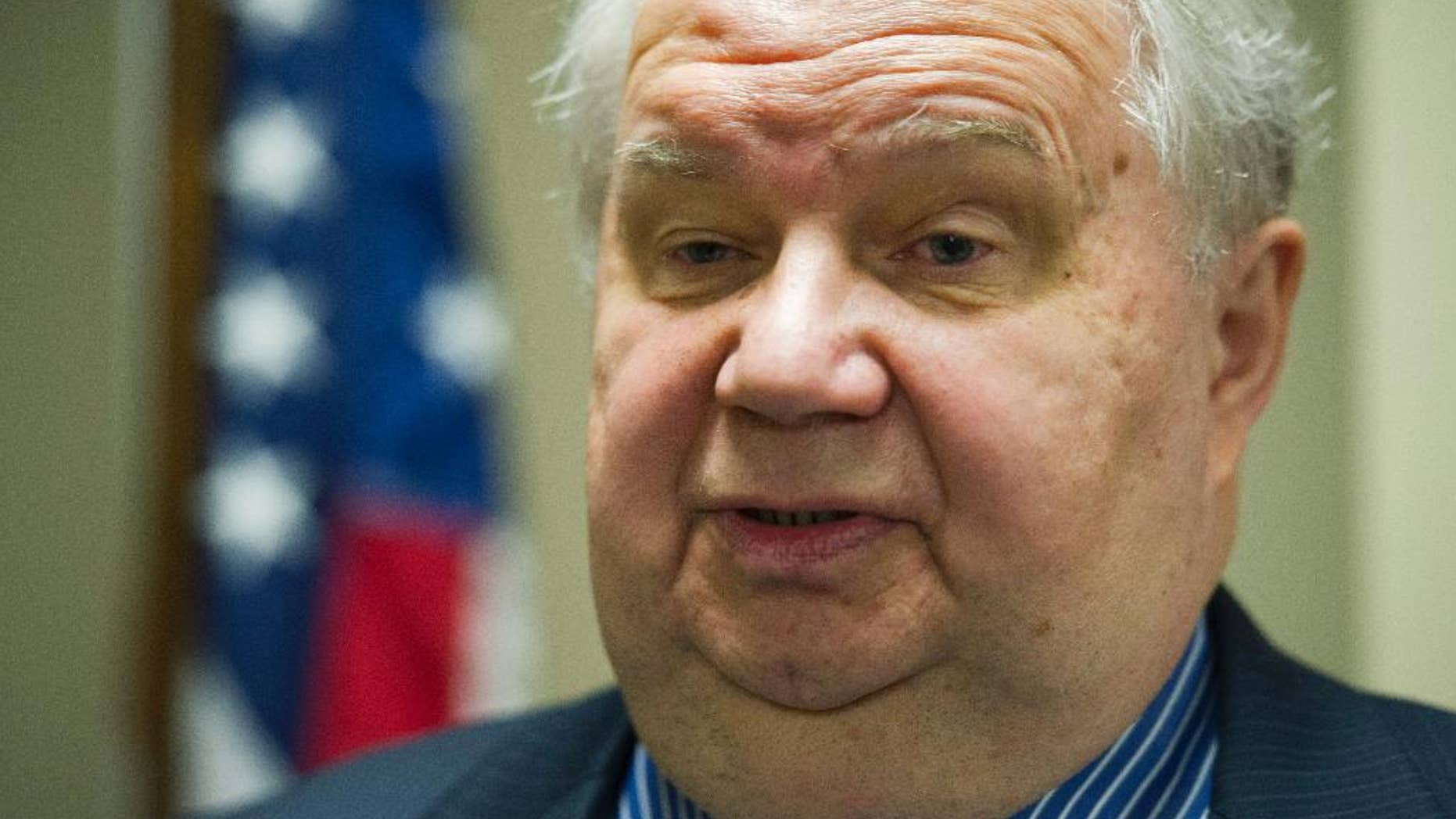 FILE - In this Sept. 6, 2013, file photo, Sergey Kislyak, Russia's ambassador to the U.S. speaks with reporters following his address on the Syrian situation at the Center for the National Interest in Washington. A member of Donald Trump's transition team asked national security officials in the Obama White House for the classified CIA profile on Kislyak. The unusual request appears to signal that Trump's own team had concerns about whether his pick for national security adviser, Mike Flynn, fully understood that he was dealing with a man rumored to have ties to Russian intelligence agencies. (AP Photo/Cliff Owen, File)