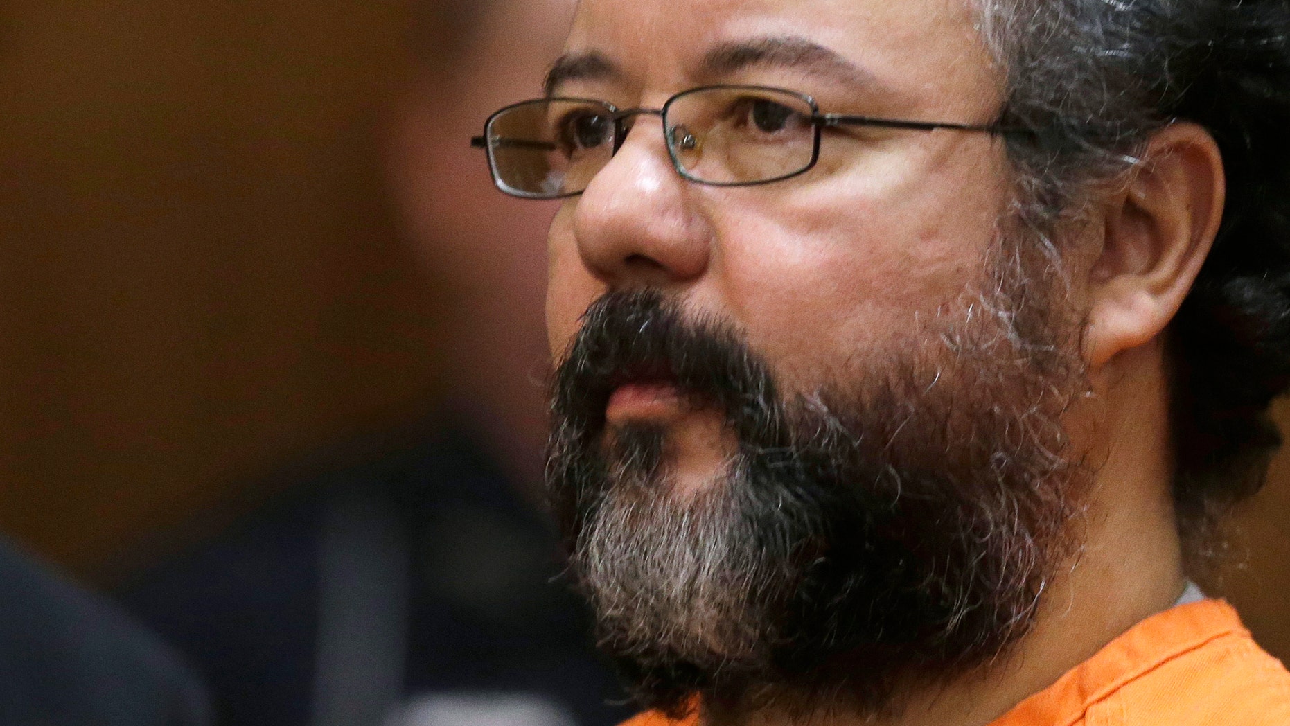 FILE - This Aug. 1, 2013 file photo shows Ariel Castro in the courtroom during the sentencing phase in Cleveland. Castro committed suicide when he hanged himself in his cell, two nationally regarded corrections consultants concluded following a review of his death released Tuesday, Dec. 3, 2013, rejecting earlier suggestions he may have died accidentally while seeking a sexual thrill. (AP Photo/Tony Dejak, File)