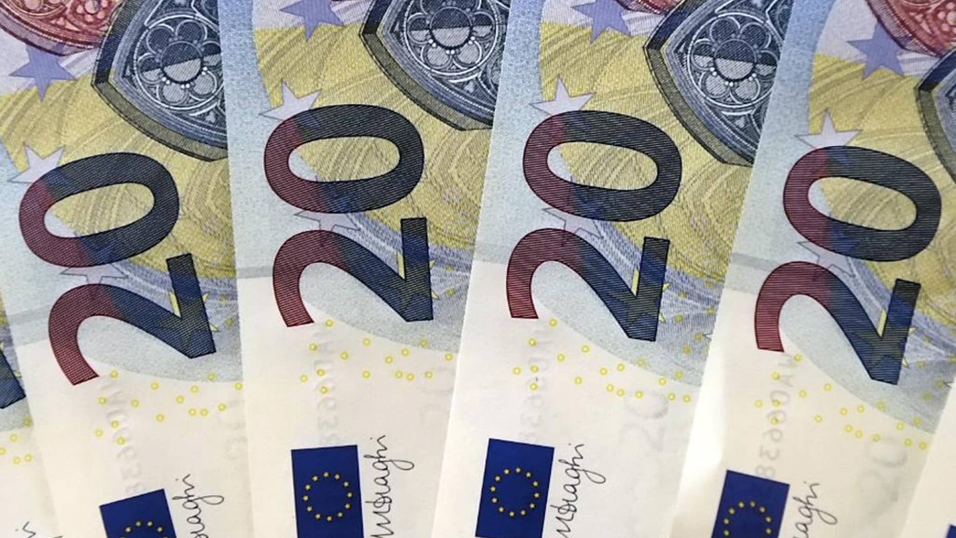 FILE - In this Tuesday, Oct. 27, 2015, file photo, new 20 euro banknotes are arranged for display during a news conference at the branch office of the German Federal Bank in Erfurt, Germany. No one is lining up to join the 19-country currency, and the next memberships, if any, will only be years down the road, certainly not in this decade. It marks a shift from a recent boom in membership, with seven countries joining in the past nine years, and reflects in part a growing wariness of forging closer economic ties. (AP Photo/Jens Meyer, File)