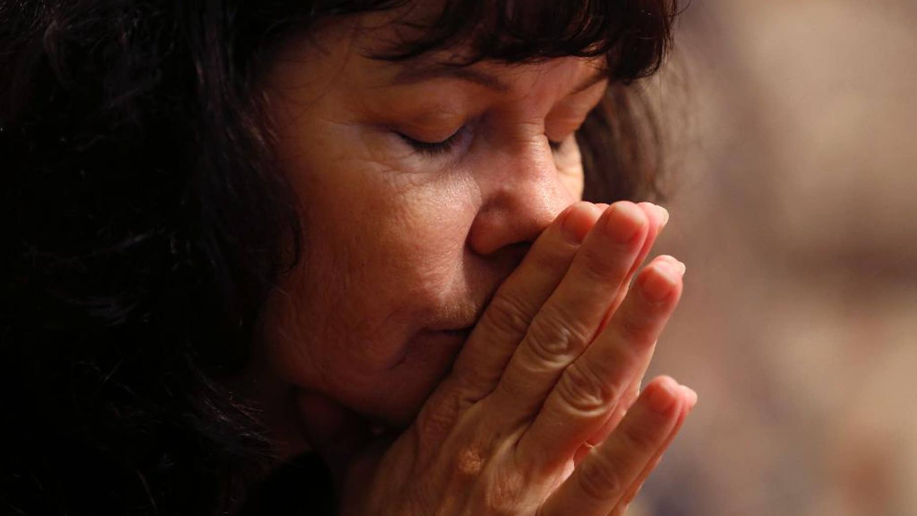 In this Monday, Aug. 8, 2016 photo, Tammy Glover, whose daughter, Danelle Keim, was a key witness in the case against former St. Charles Parish District Attorney Harry Morel before she died of a drug overdose in 2013, pauses while speaking at her home in Destrahan, La. Former Louisiana prosecutor Harry Morel, 73, is accused of soliciting sex from at least 20 women in exchange for favorable treatment faces sentencing, Wednesday Aug. 17, 2016, on a single charge of obstruction of justice. Morel faces a maximum of three years in prison under his guilty plea. According to the FBI and the local sheriff, the 73-year-old prosecutor solicited sex from at least 20 women, including Danelle Keim, in exchange for favorable treatment. (AP Photo/Gerald Herbert)